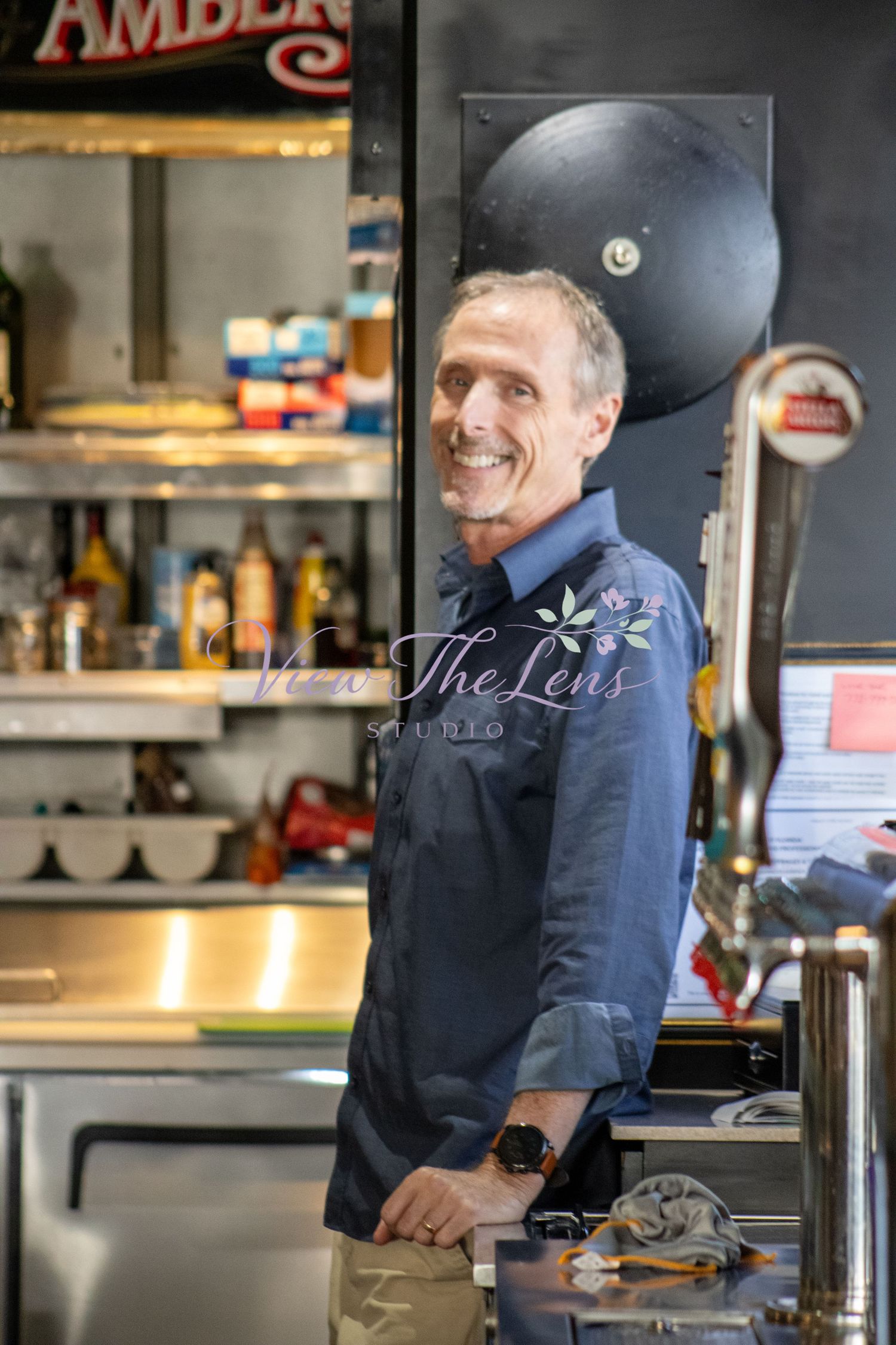 Professional branding portrait of a business owner inside their workplace.