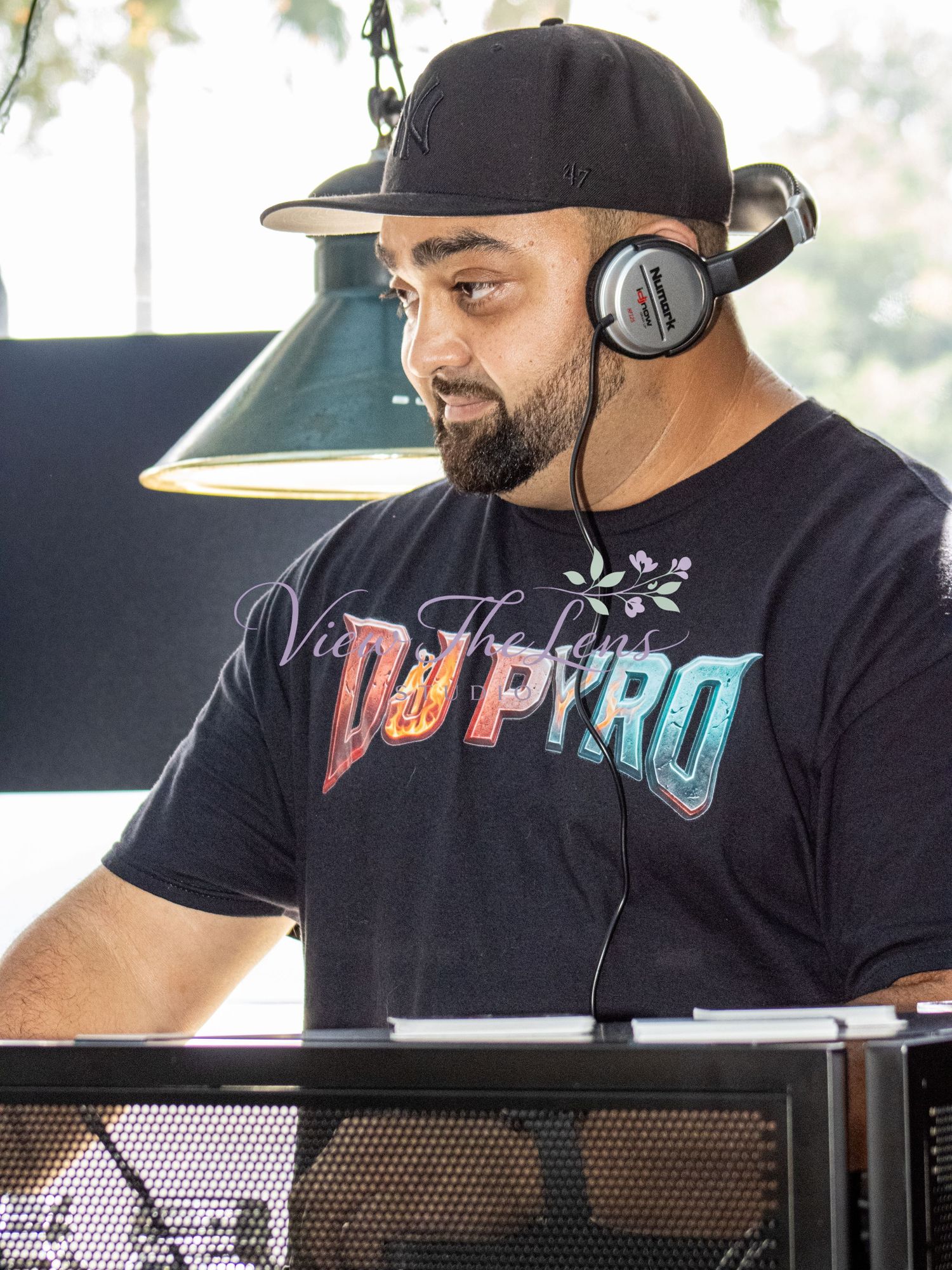 Professional DJ operating sound equipment during a special event.