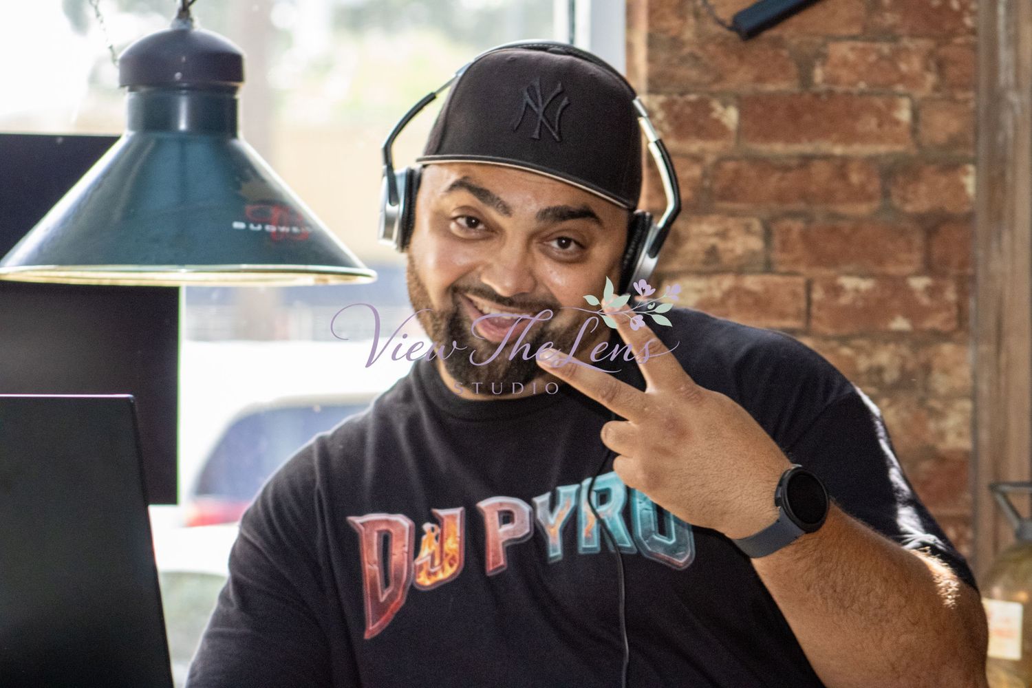 DJ providing music and entertainment during a community event photographed by View The Lens Studio.