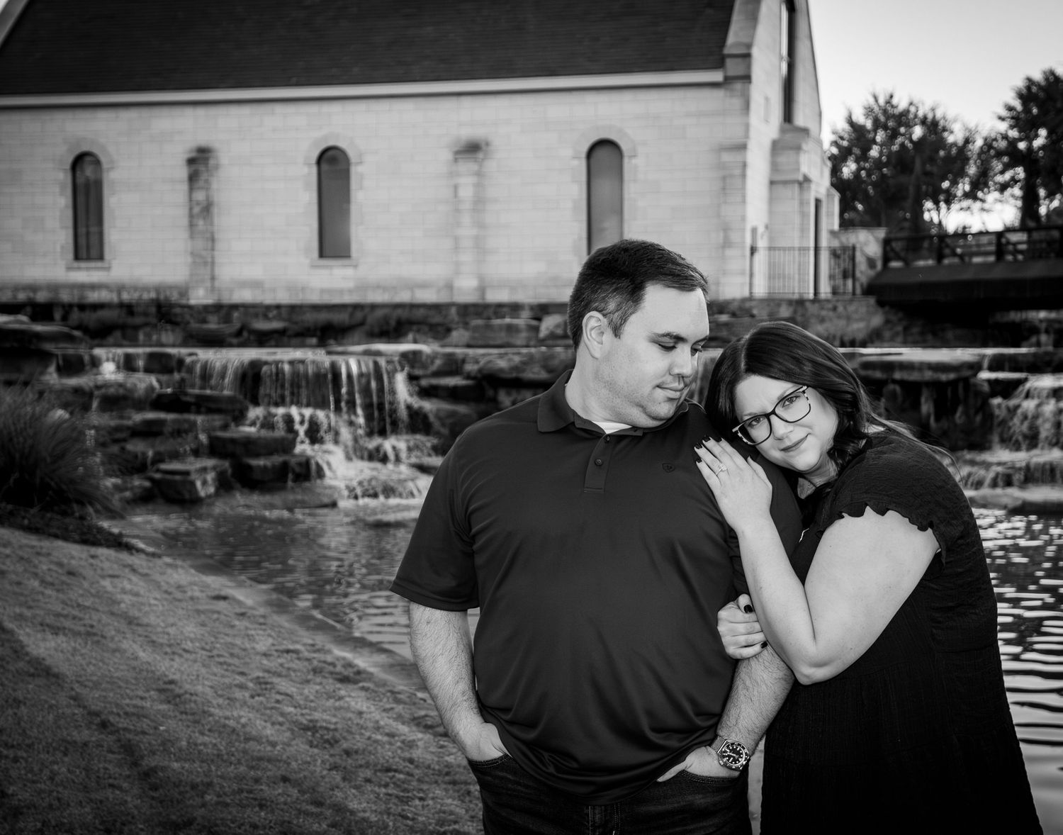 A dramatic black and white photograph of a couple
