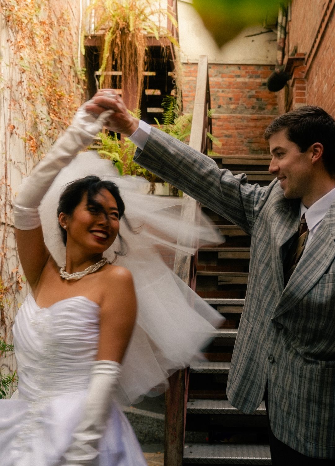 Bride and groom dancing in a narrow brick alley near Dihua Street in Taipei