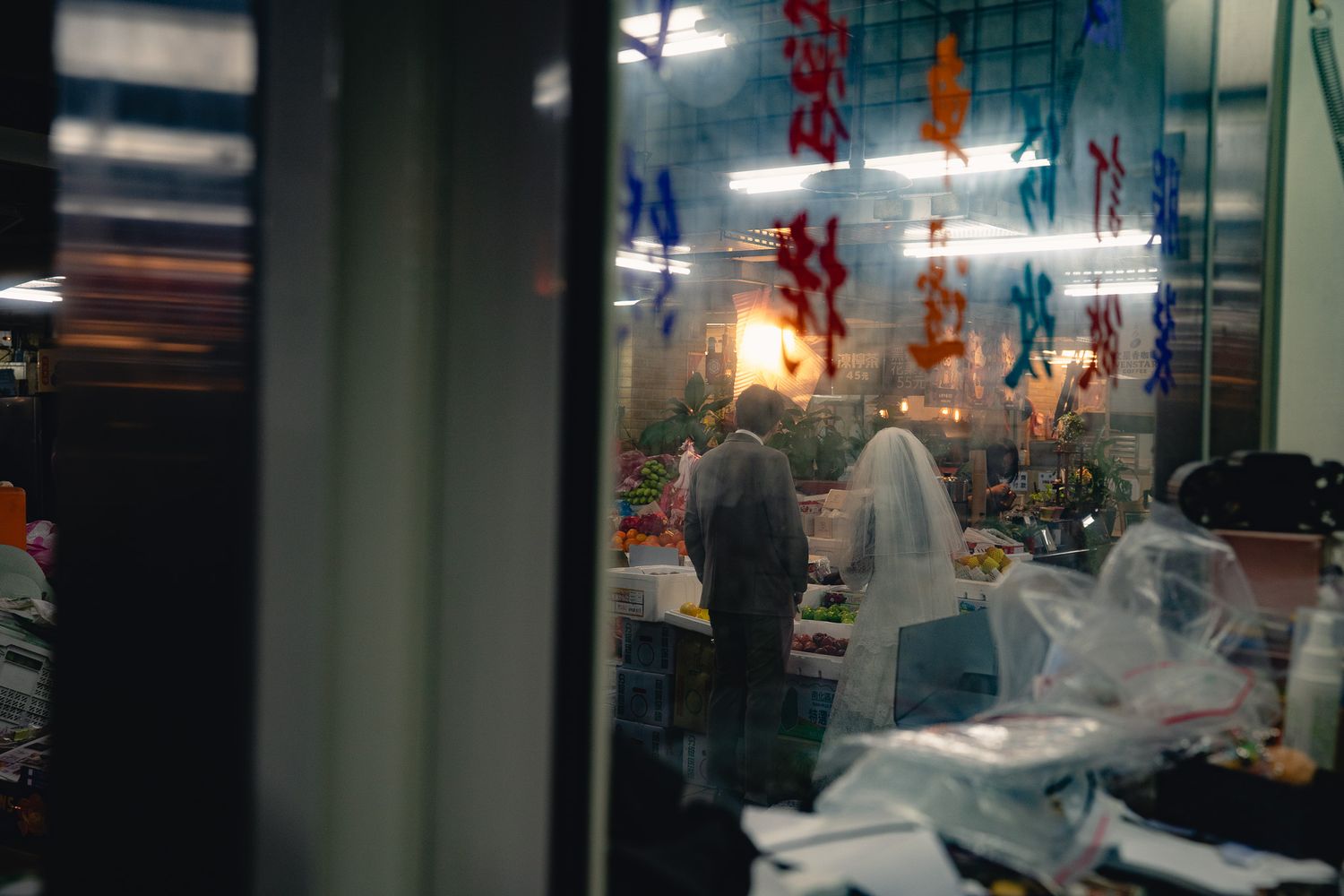 Cinematic Taipei pre-wedding photo of a couple in a traditional Taiwanese market