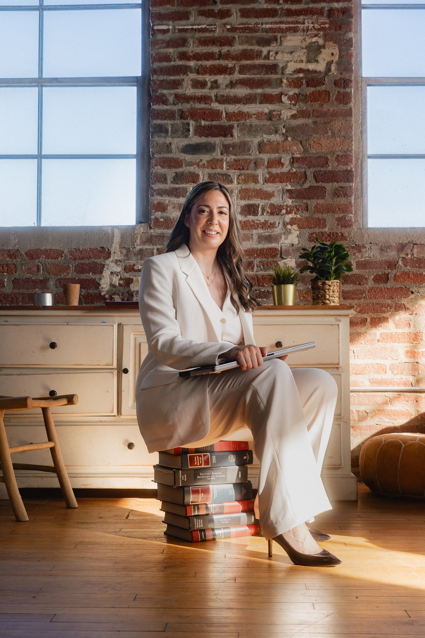 Taipei personal branding portrait of a consultant seated in a warm studio with natural light