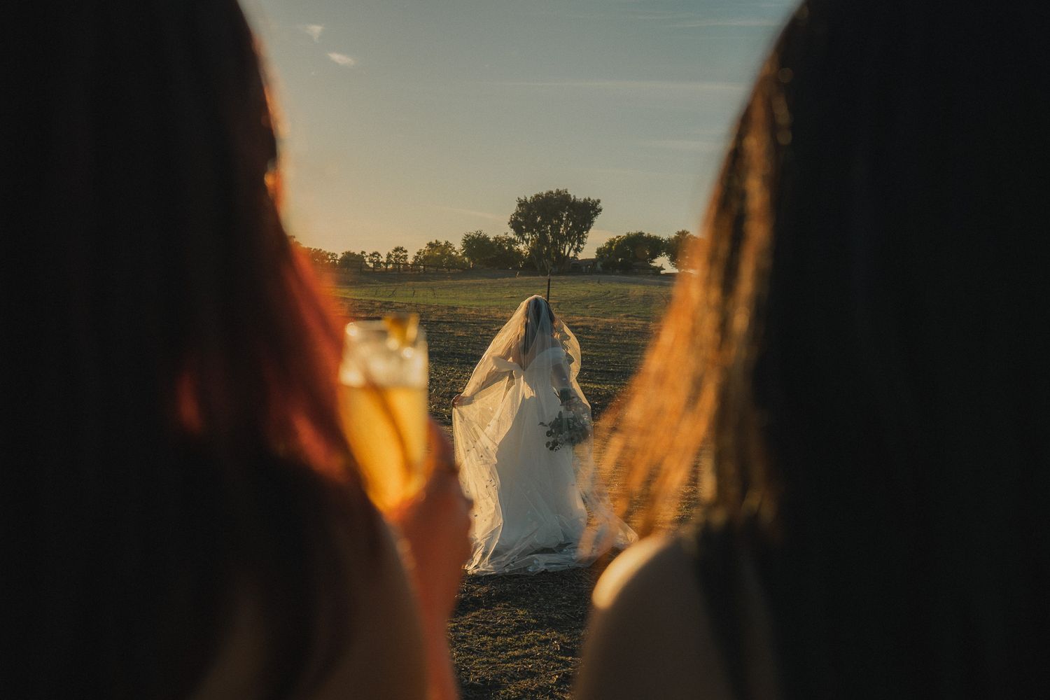 Taiwan wedding photography moment with bride walking through a golden sunset field
