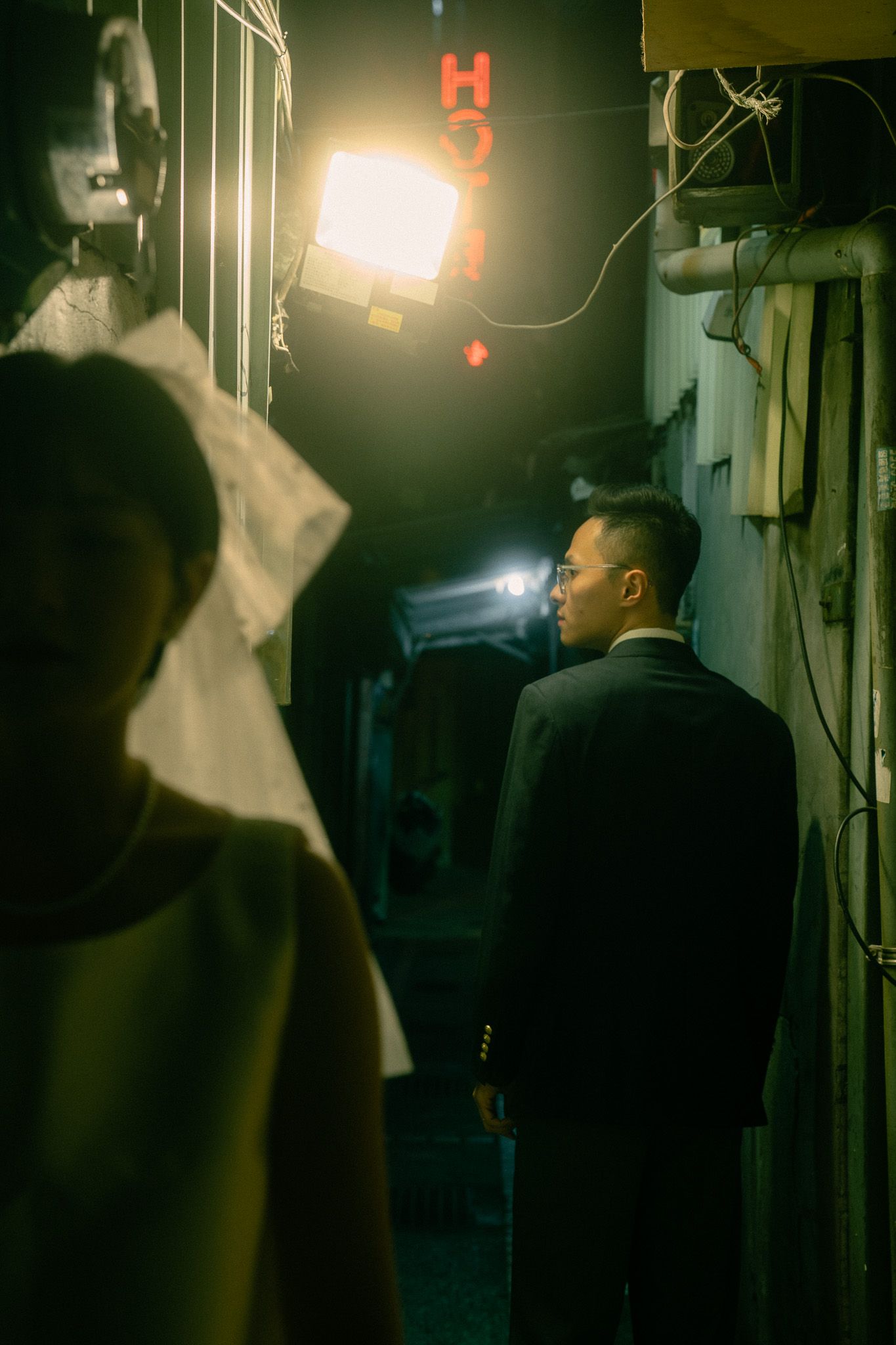 Moody Wong Kar Wai Style Taipei pre-wedding photography in a neon-lit alley with cinematic atmosphere