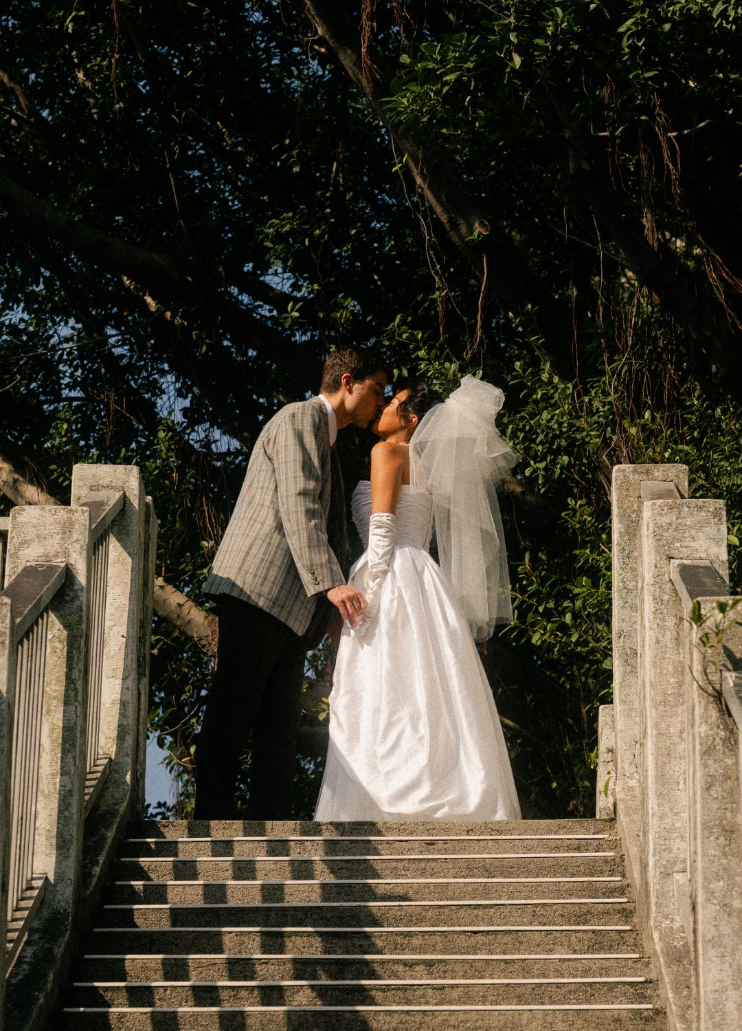 Bride and groom standing on an old pedestrian bridge during a Taipei pre-wedding photoshoot