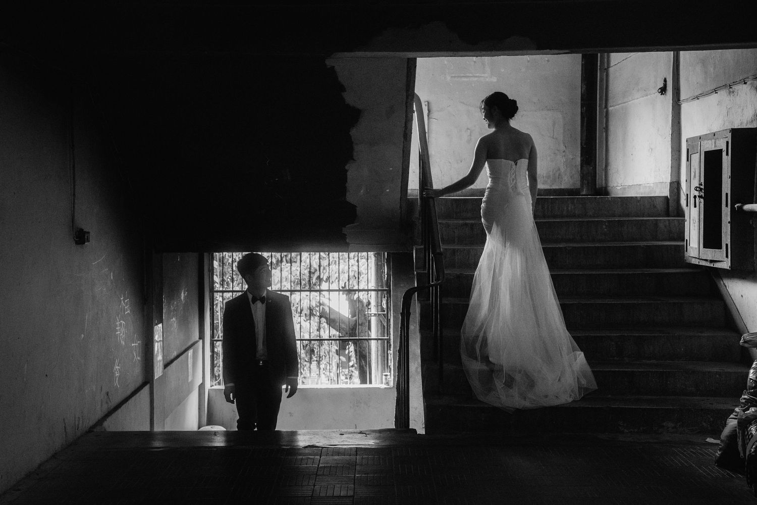 Black and white cinematic Taipei pre-wedding photoshoot on a stairs at an apartment, editorial and timeless