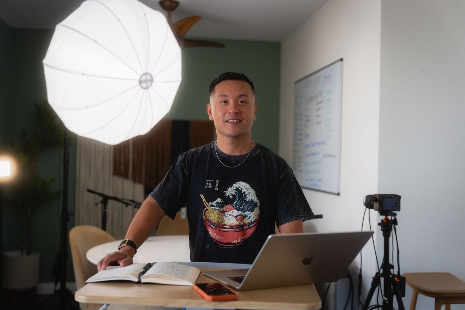 Taipei personal branding photography for a creator working at a desk with camera and studio light
