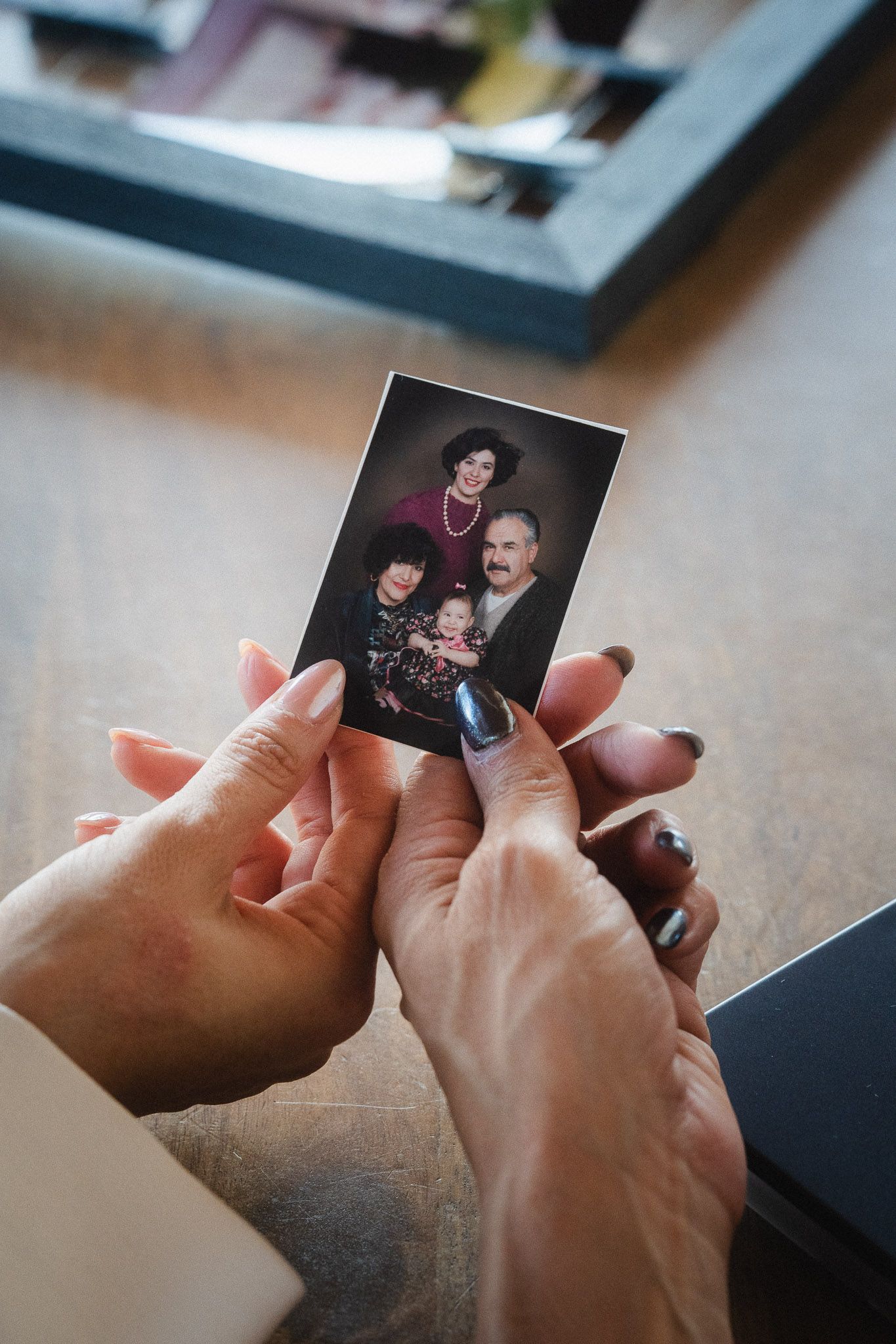 Taipei branding photography detail of a client holding a printed family photo