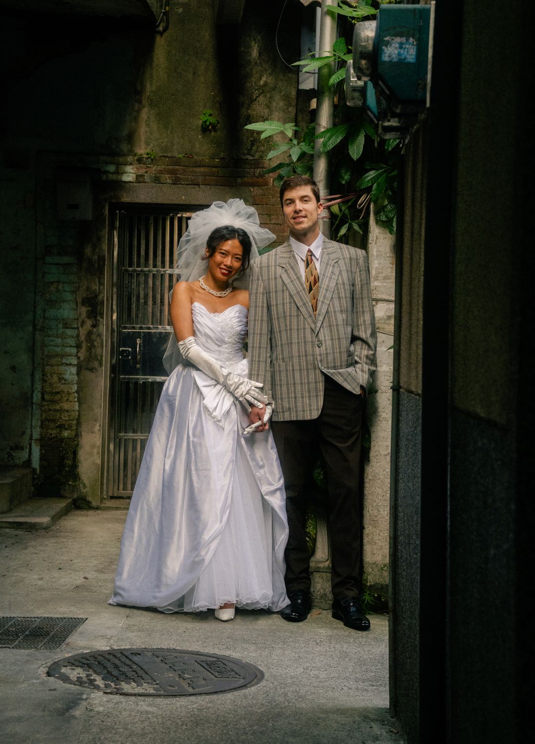 Emily and Nik exploring Dadaocheng together during their vintage-inspired Taipei engagement photoshoot