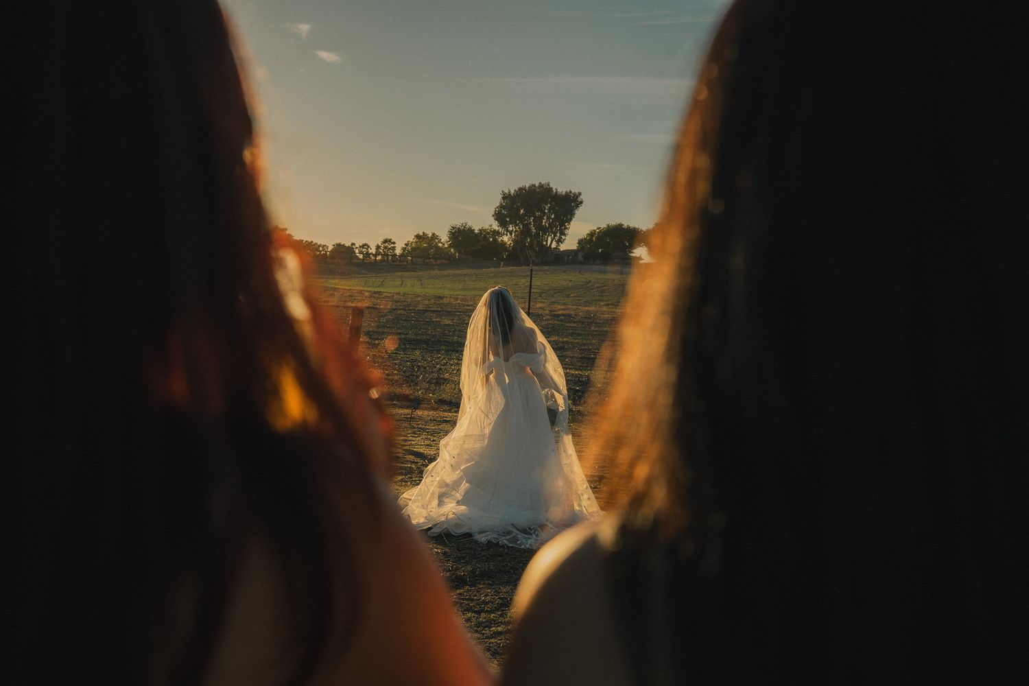 Taiwan wedding photography of a bride walking through a golden field at sunset