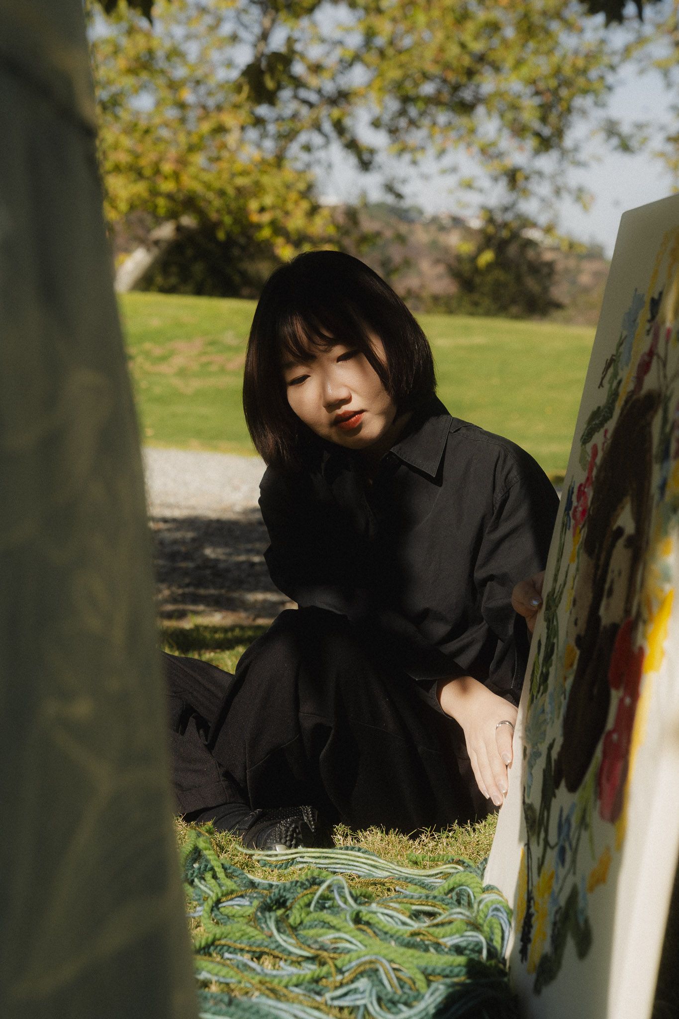 Professional personal branding photography in Taiwan for artist outdoor showcasing her artwork