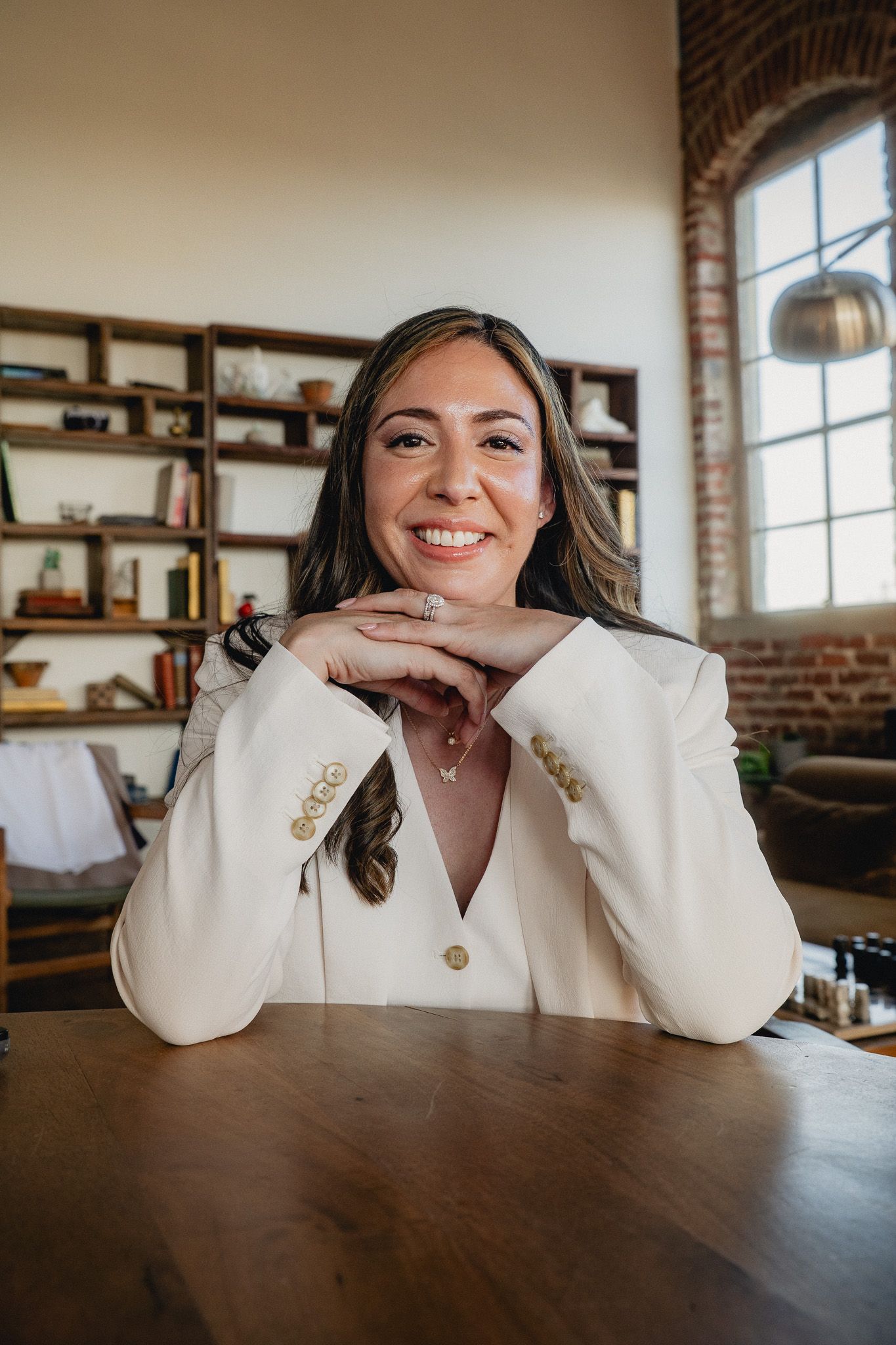 Taipei personal branding portrait of a professional woman sitting at a table