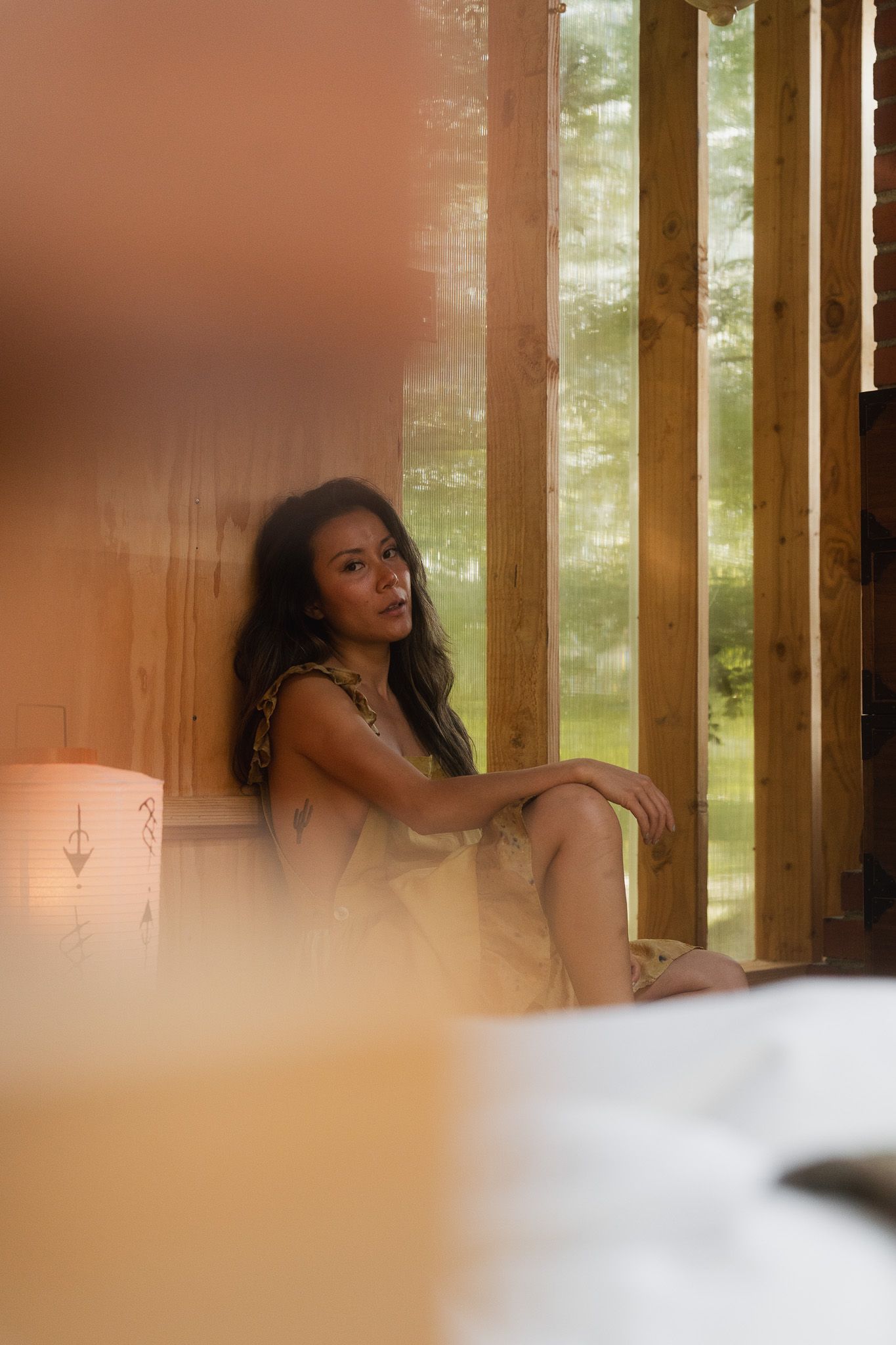 Cinematic Taipei personal branding photography of a female interior designer in soft indoor window light