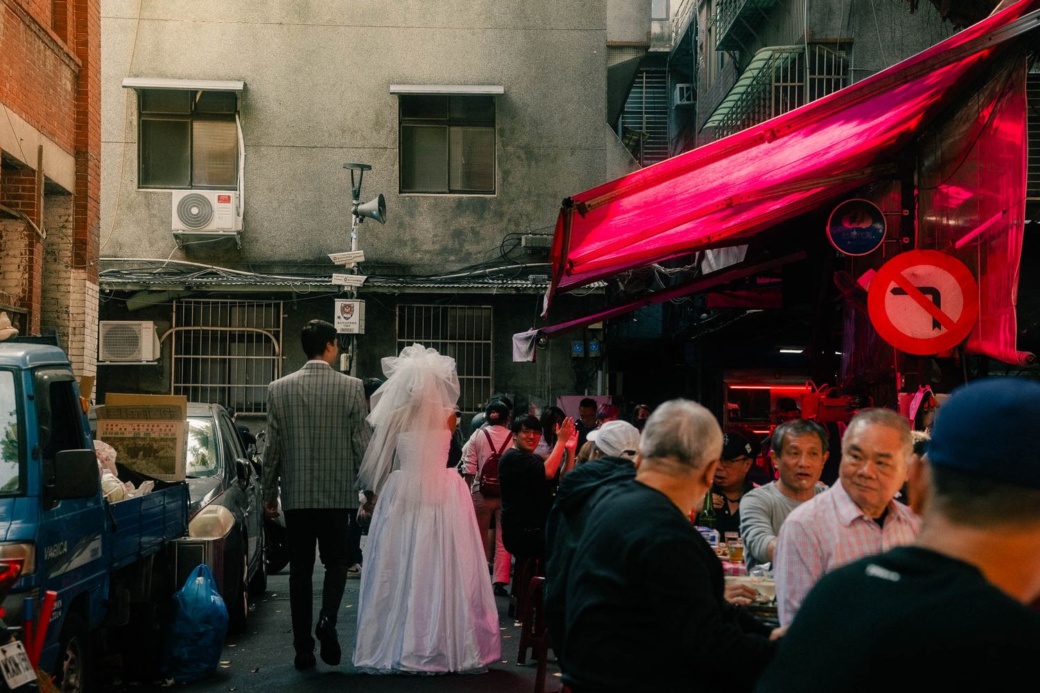 Couple exploring a traditional food market during their Dihua Street engagement photoshoot
