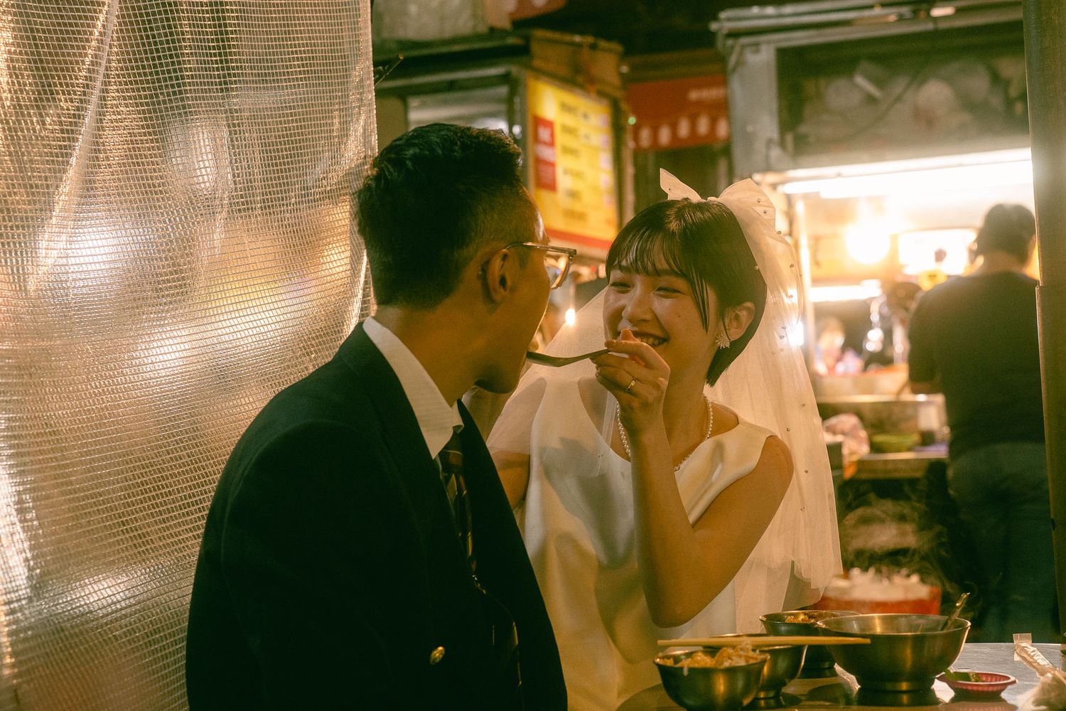 Taipei pre-wedding photography of a couple sharing food at a traditional night market stall