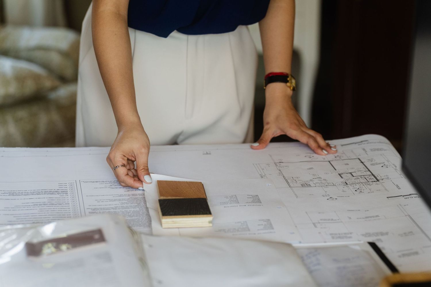 Taipei branding photography detail of an interior designer reviewing floor plans and material samples

Portrait photo