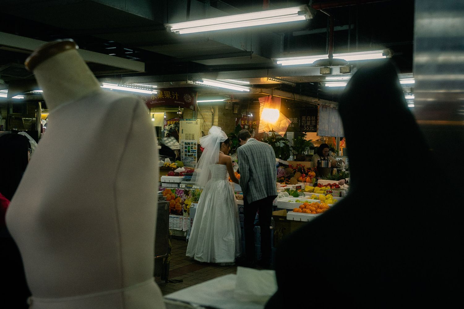 Cinematic Dihua Street pre-wedding photo of a couple surrounded by local shops and everyday Taipei life