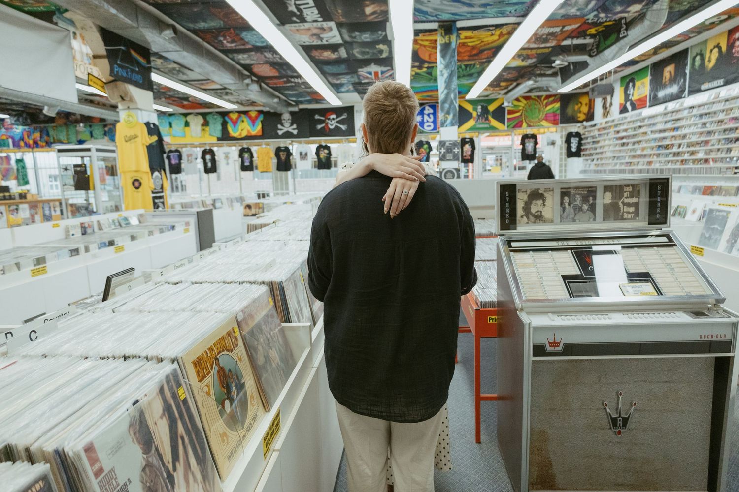Interior view of a record store showing rows of vinyl albums and display cases.
