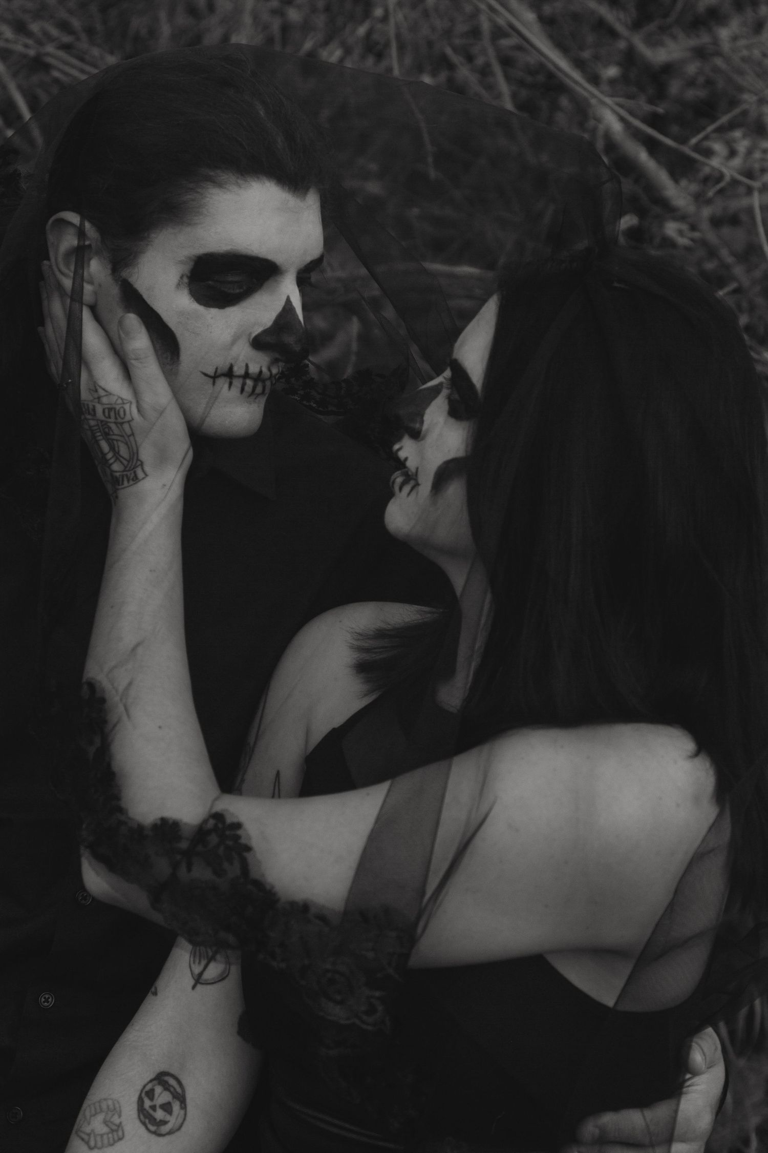 Dramatic black and white portrait with gothic makeup and dark aesthetic styling.