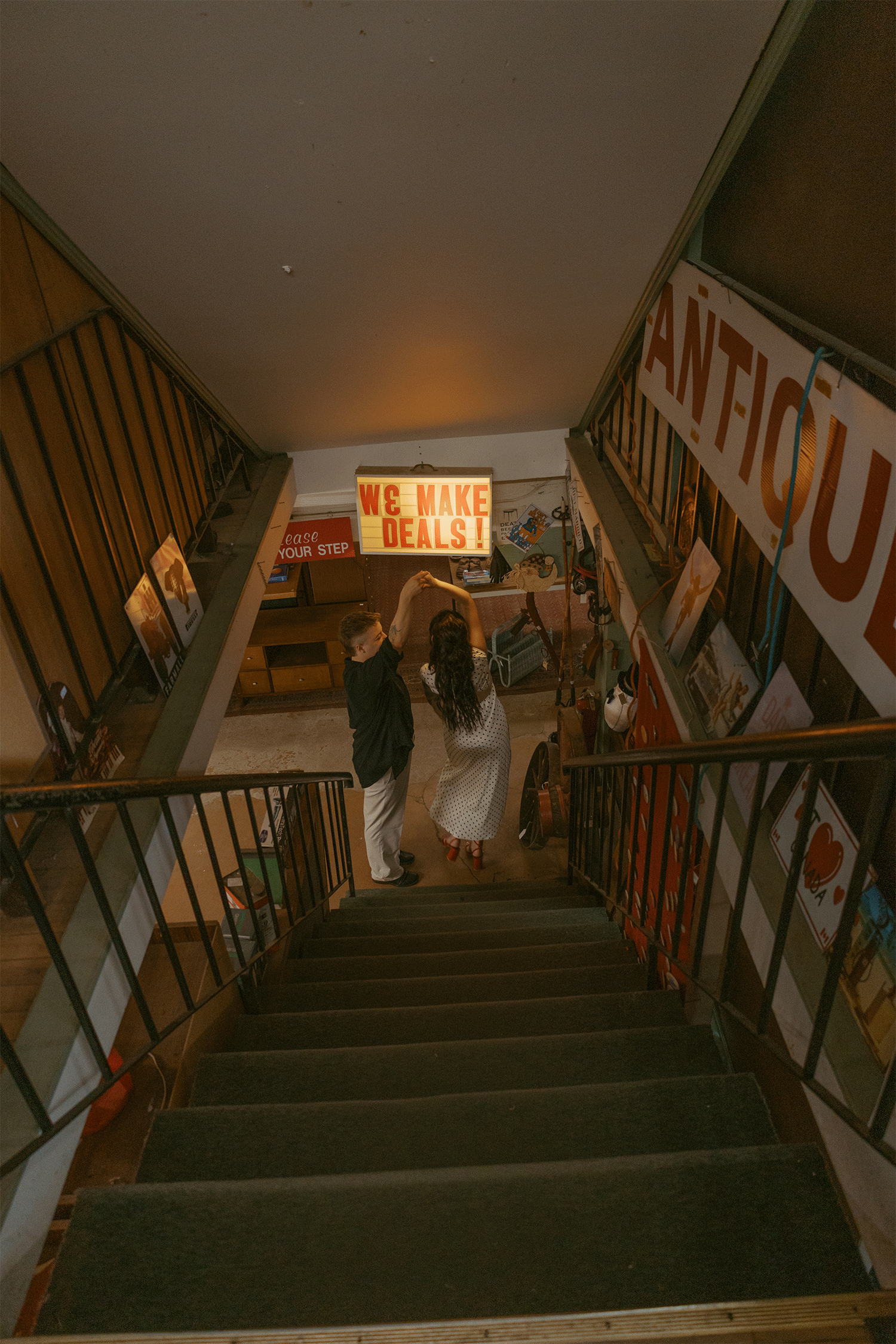 Couple dancing in an antique thrift shop