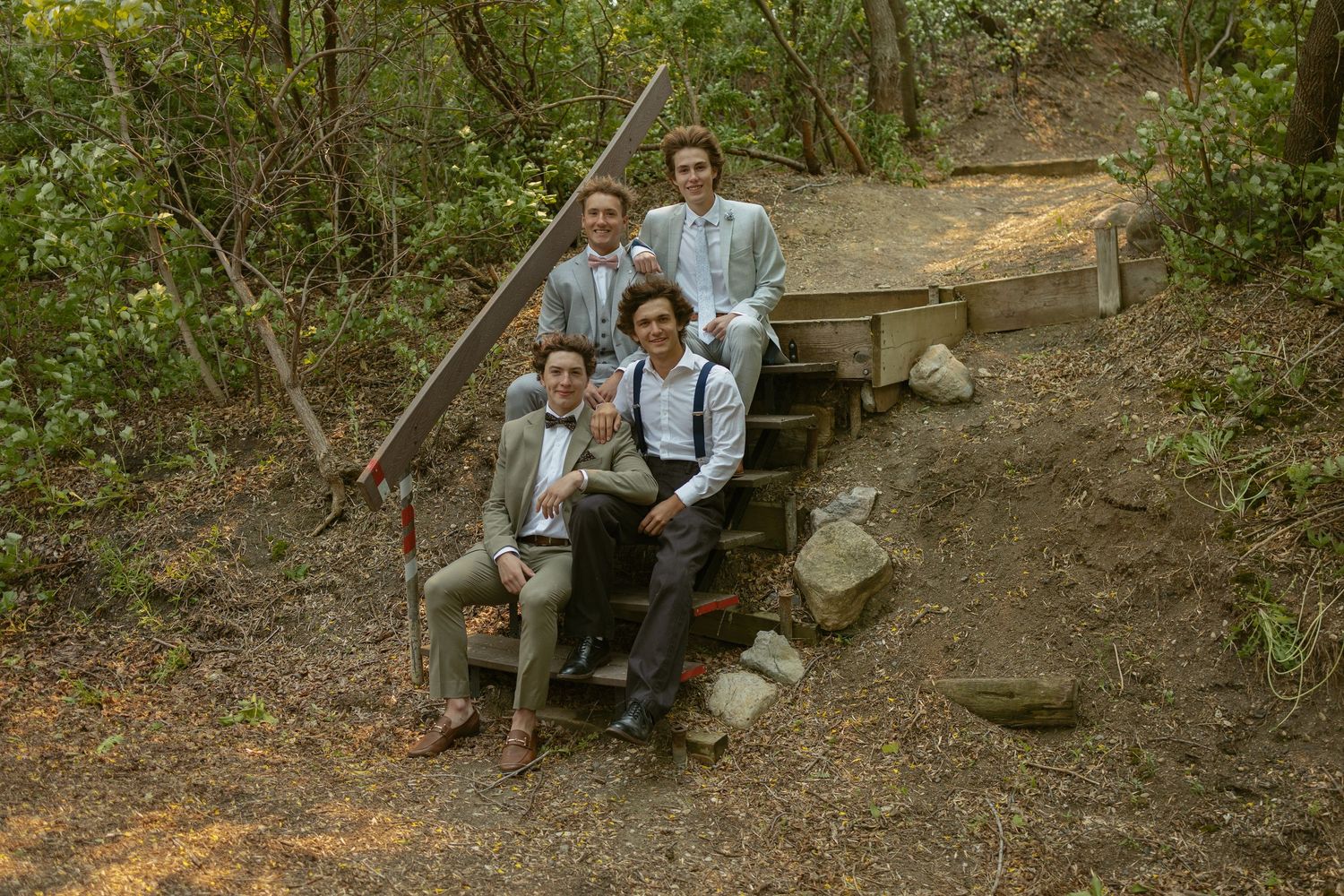 Vintage-styled scene with wooden bench and rustic props in wooded setting.