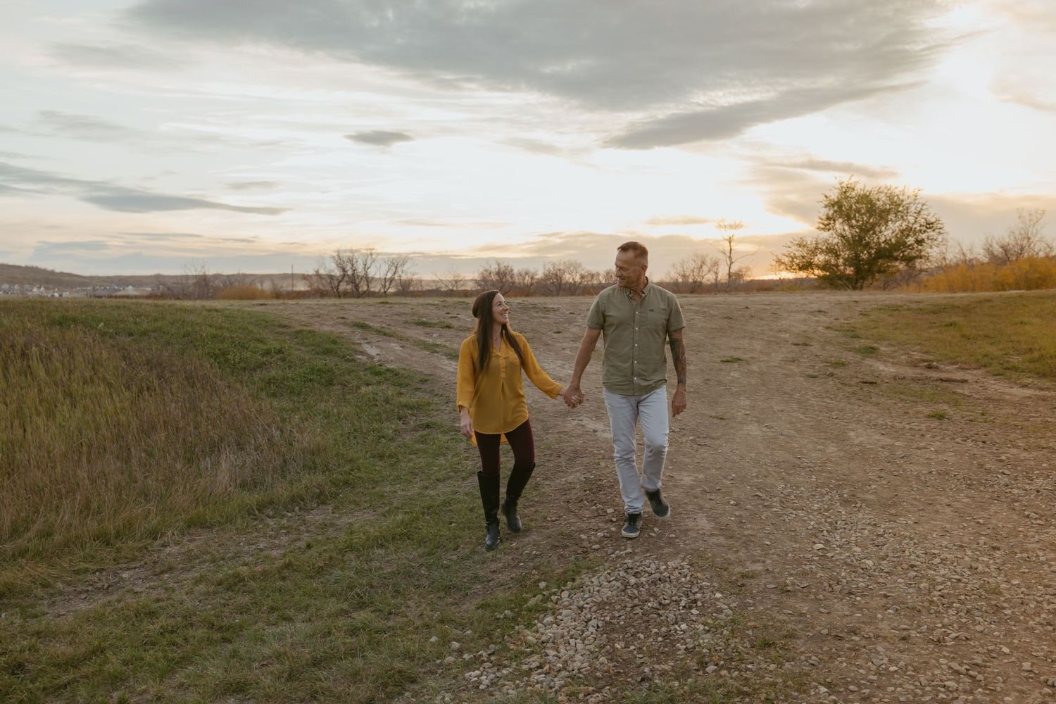 Scenic outdoor engagement photoshoot at sunset in a natural landscape.
