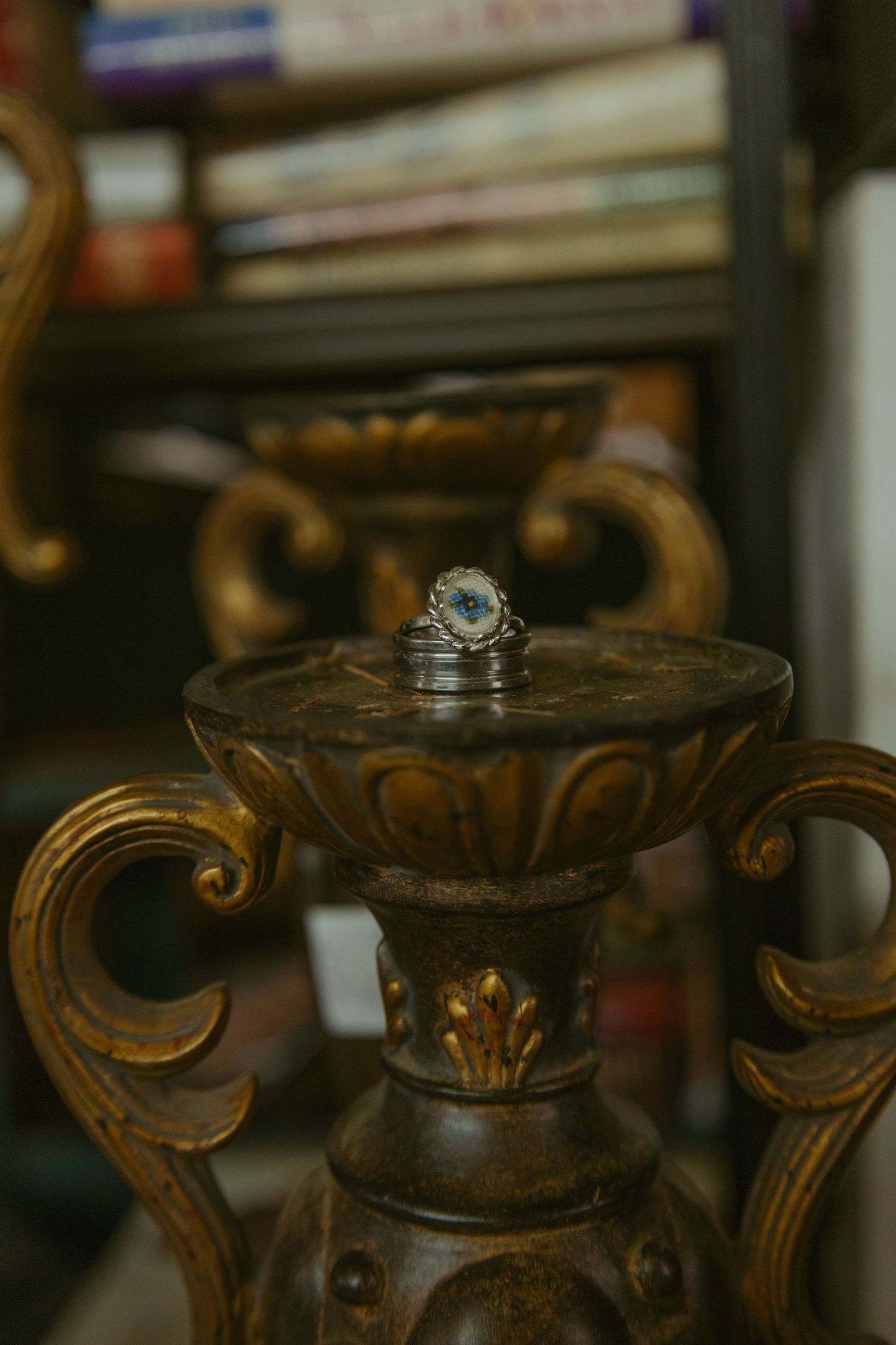 Ornate antique wooden furniture details with carved scrollwork patterns.