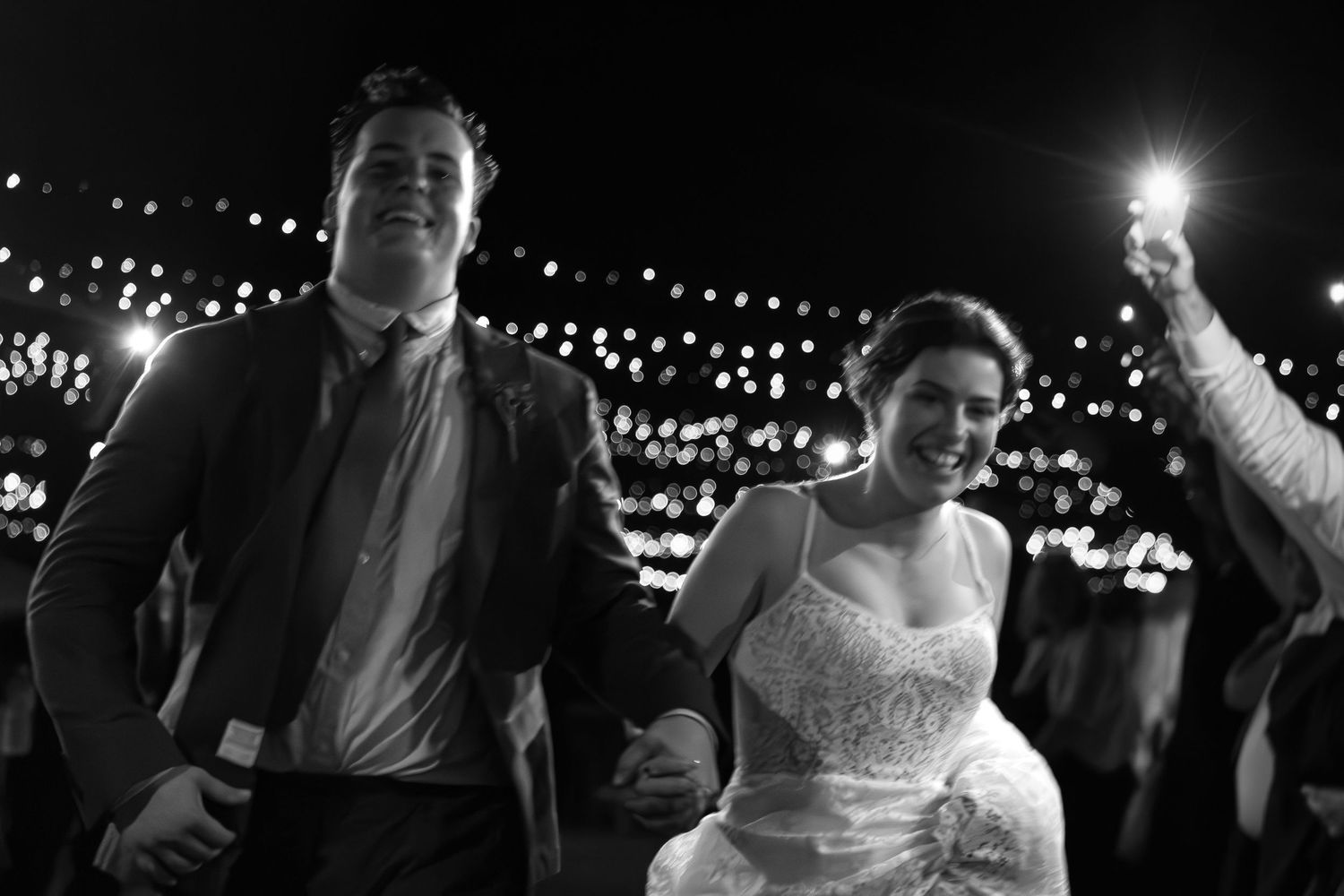 Wedding couple runs down their grand exit in Singleton, Hunter Valley.