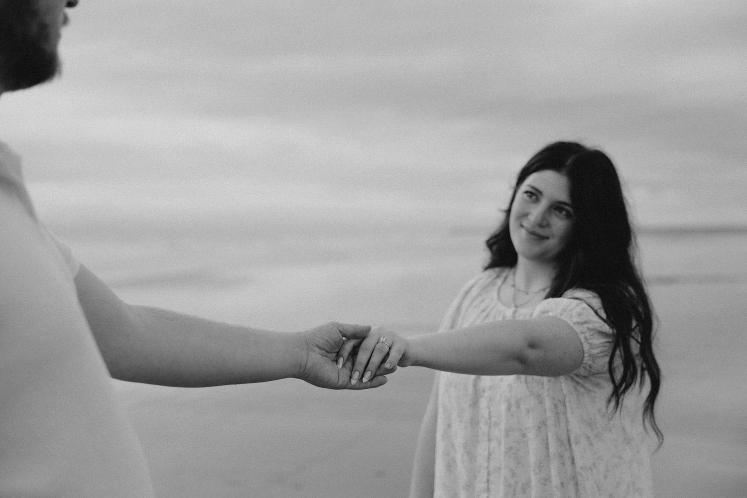 Romantic beach engagement session with ocean backdrop
Candid engagement portraits on sandy shoreline