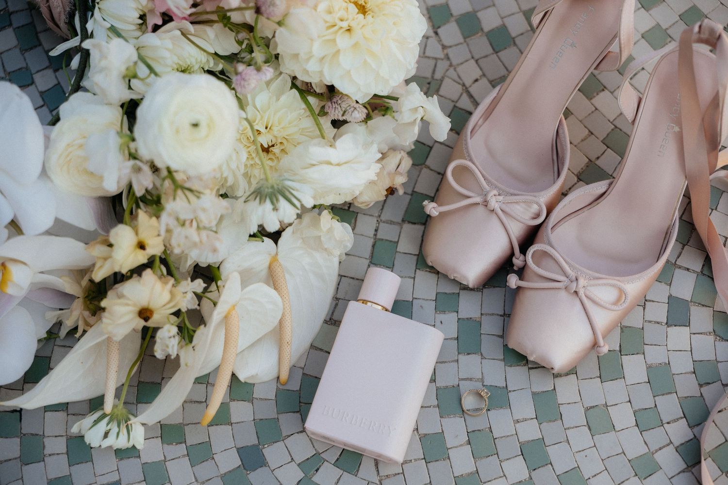 Wedding flat lay with invitation suite and rings