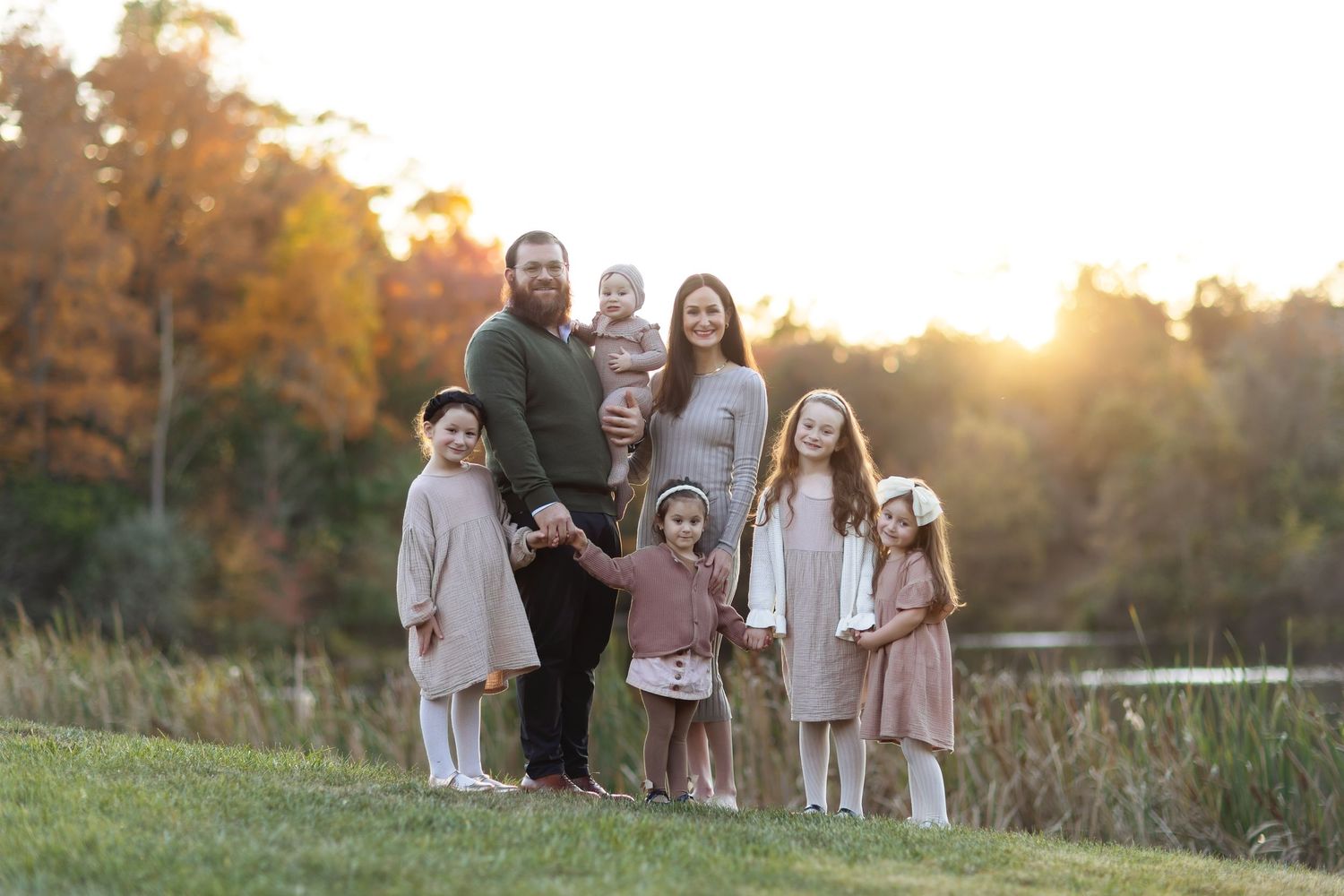 Sunset family photo session in an autumn field.