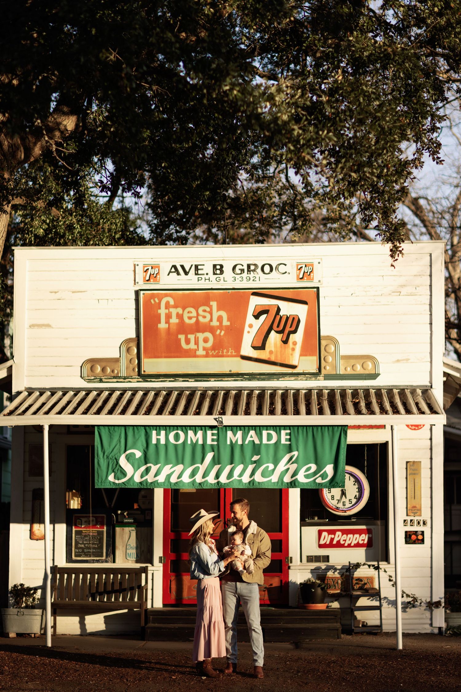 Vintage storefront with 7up sign and green 'Home Made Sandwiches' banner showing retro Americana style.