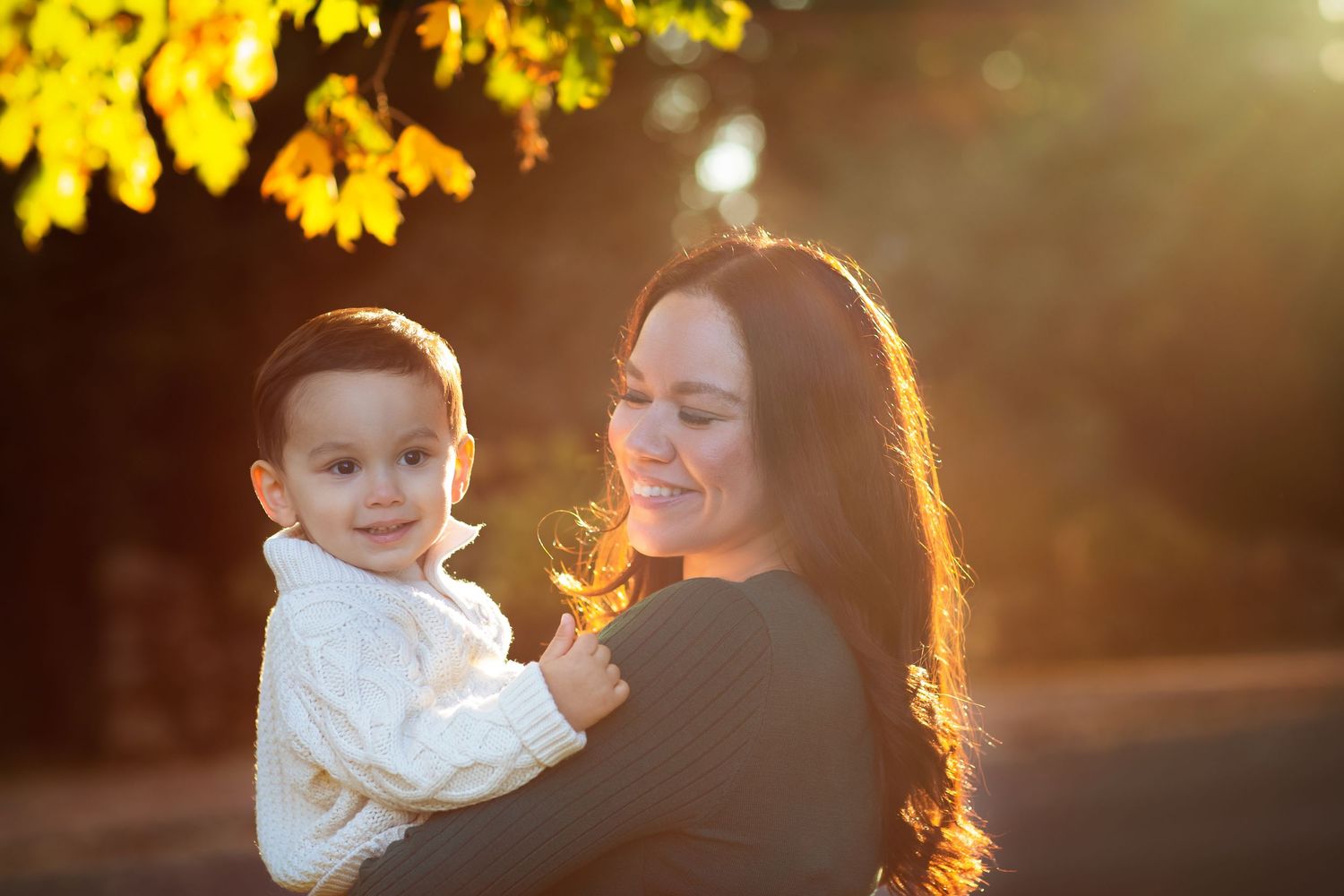 Backlit portrait of joyful moment during golden hour sunset.