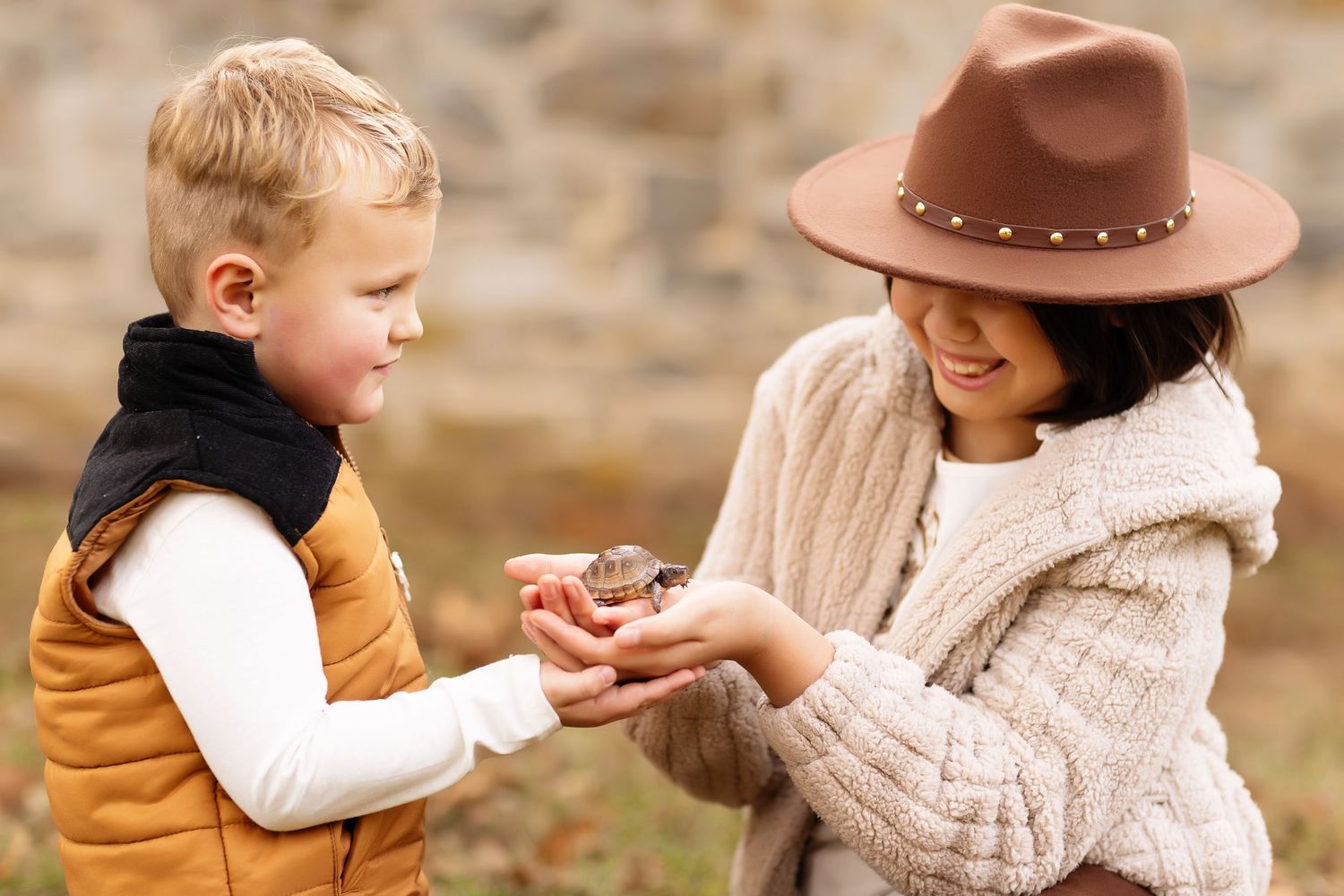 People in cozy autumn outfits sharing intimate moments outdoors.