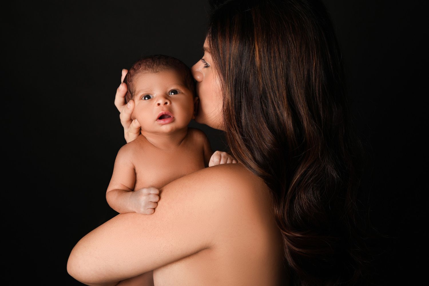 Intimate black and white newborn photography session.