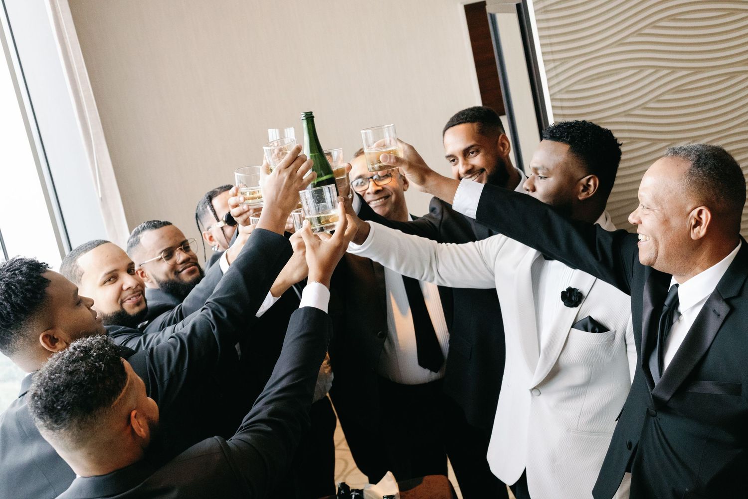 Groomsmen in dark suits celebrate and cheer together in a candid photo sequence.