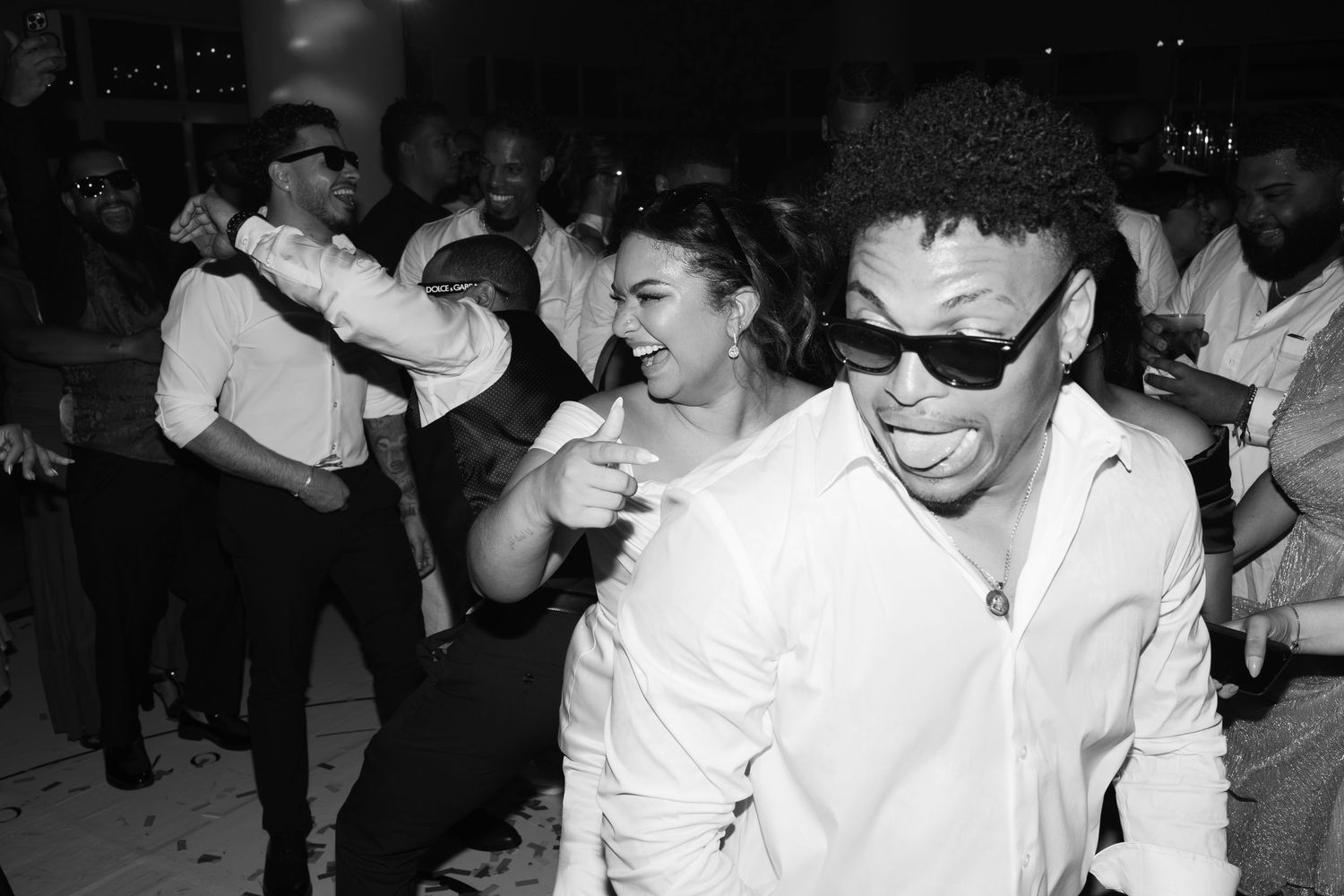 A sequence of black and white photos showing people dancing and enjoying themselves at what appears to be a celebration.