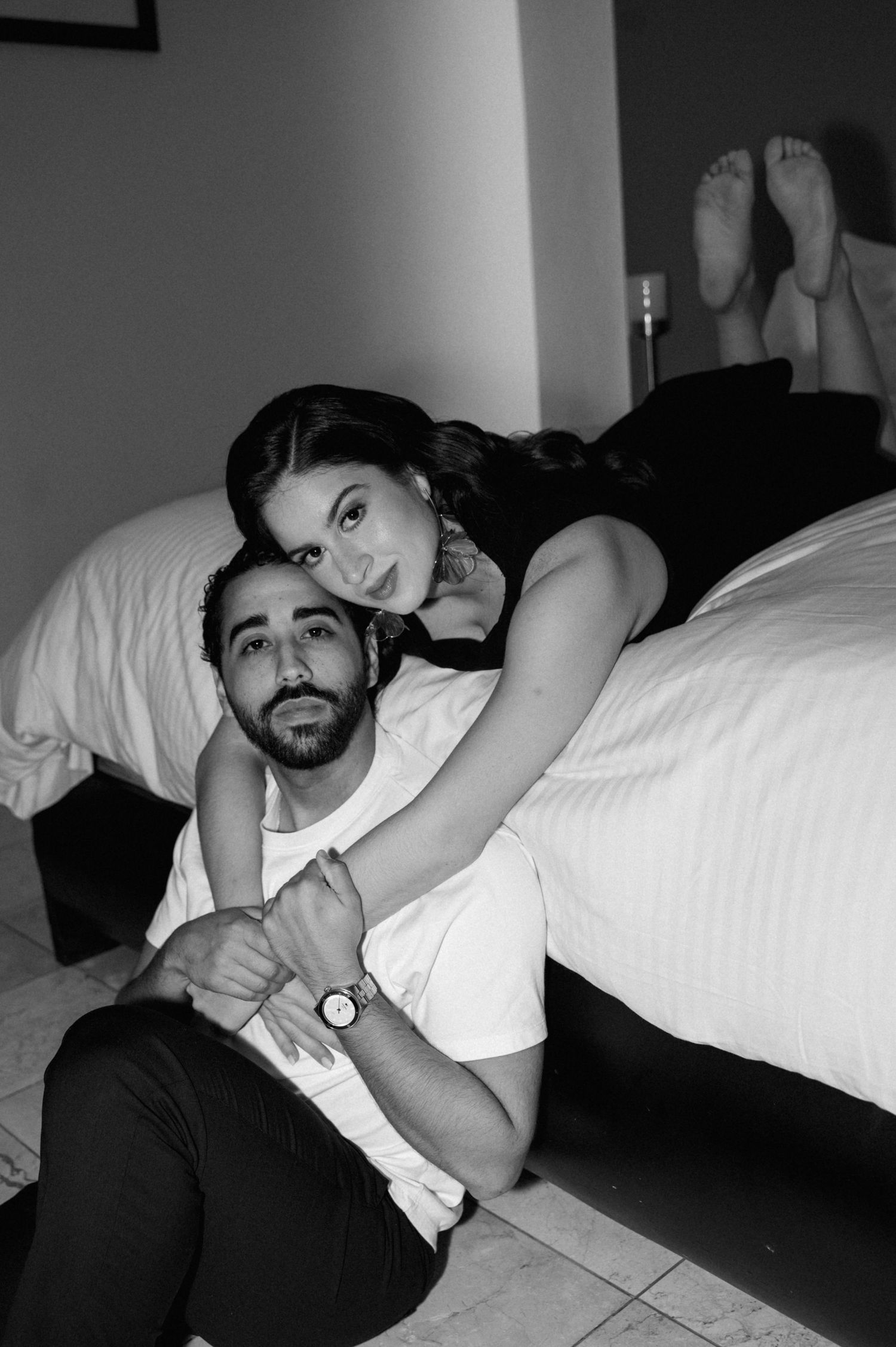 A series of black and white photos showing someone reclining on a bed in a dimly lit room.
