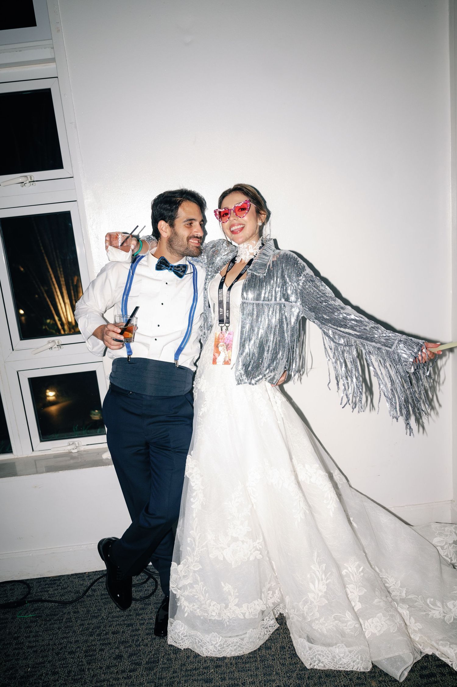 A couple in formal wedding attire dances and twirls together in a series of candid reception photos.