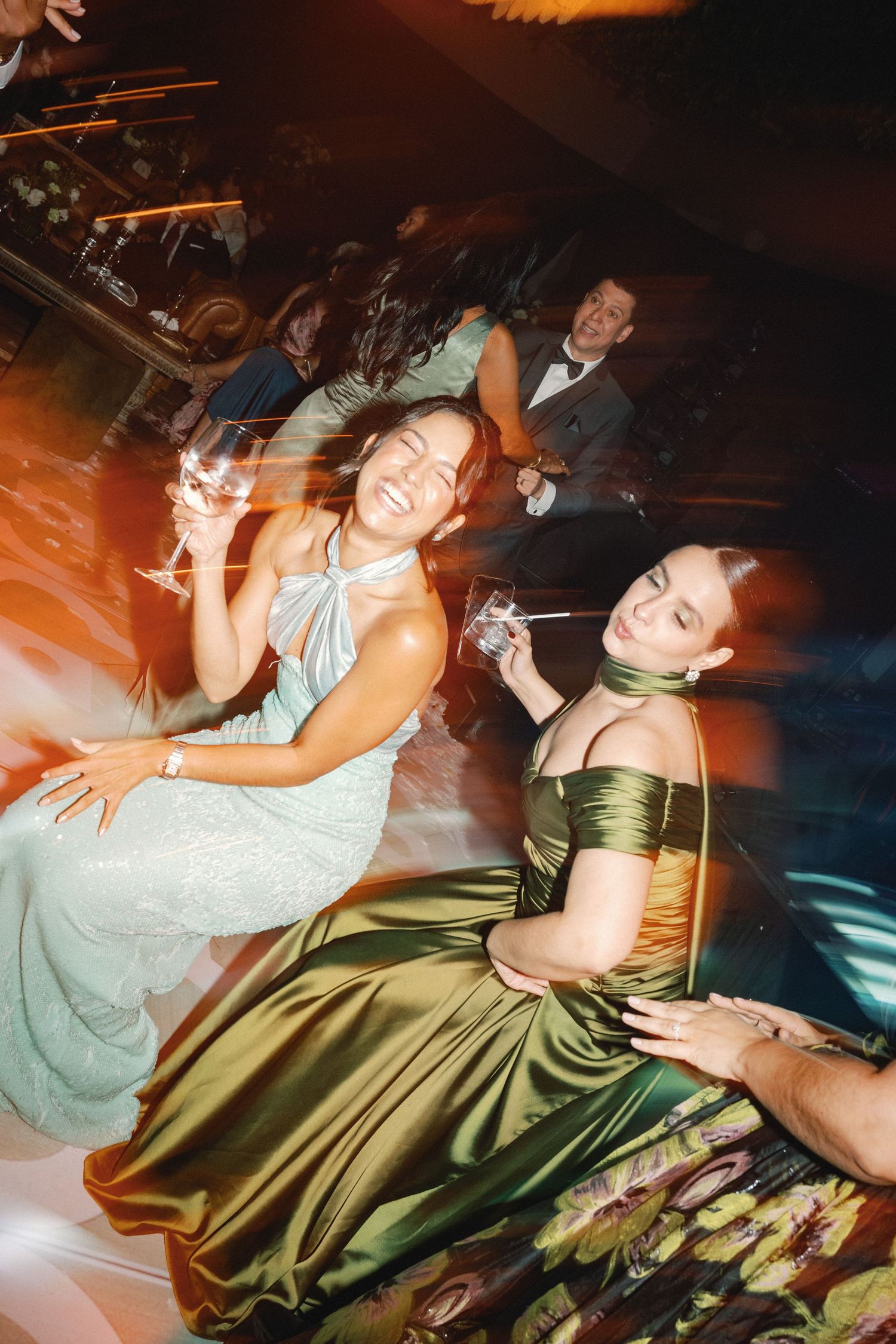 People dancing and having fun at a party with dynamic lighting and movement captured in sequence.