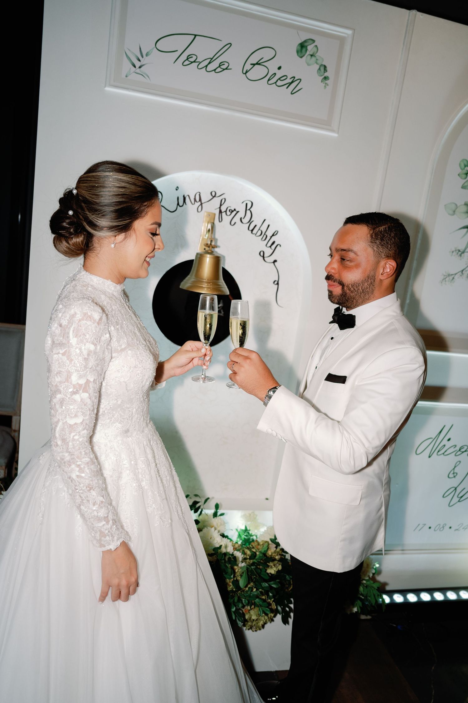A series of wedding photos showing a couple toasting with champagne glasses against a white backdrop with green decor.