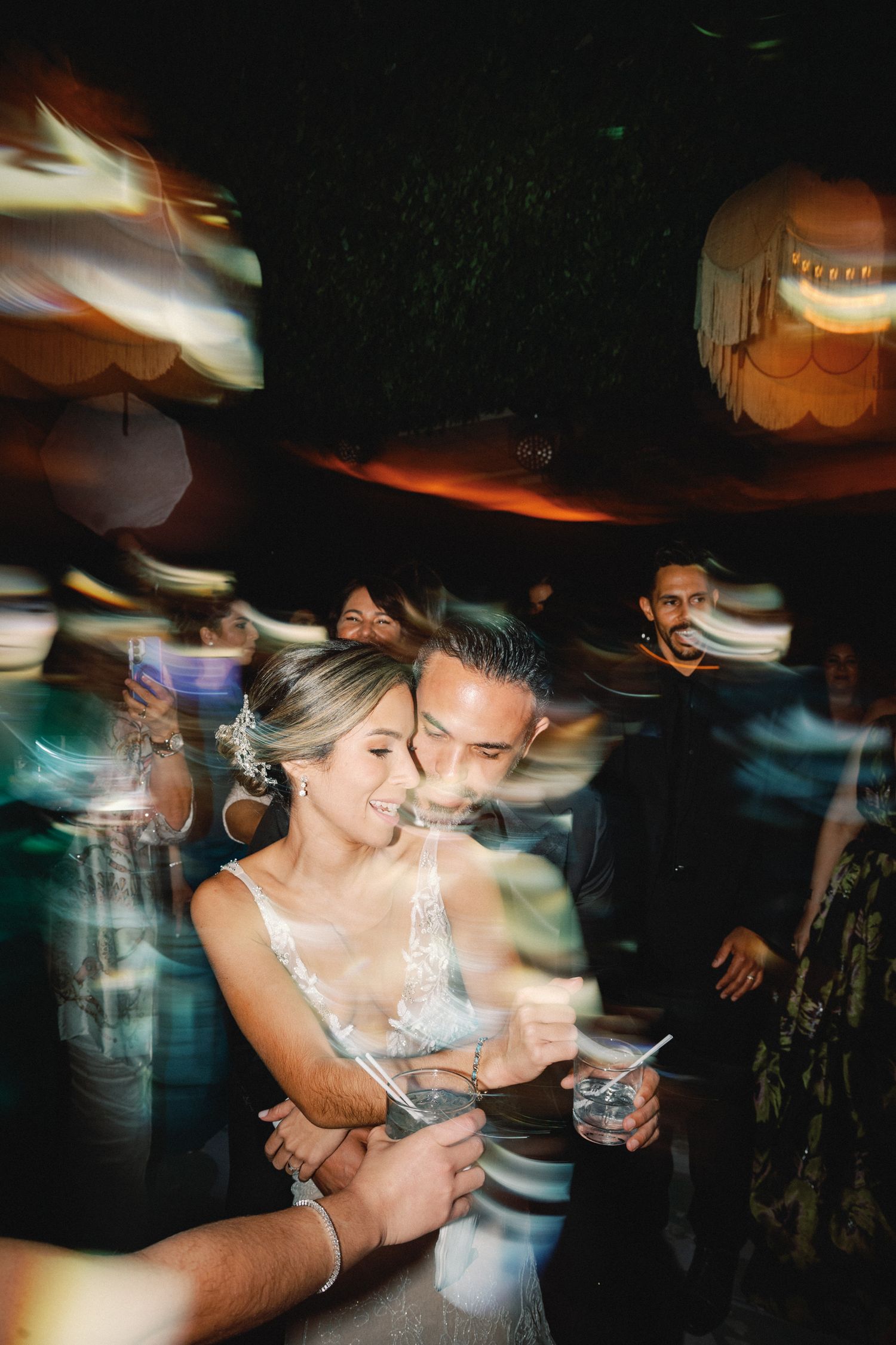Dynamic nightclub scene with motion blur and colorful lighting effects creating an energetic atmosphere.