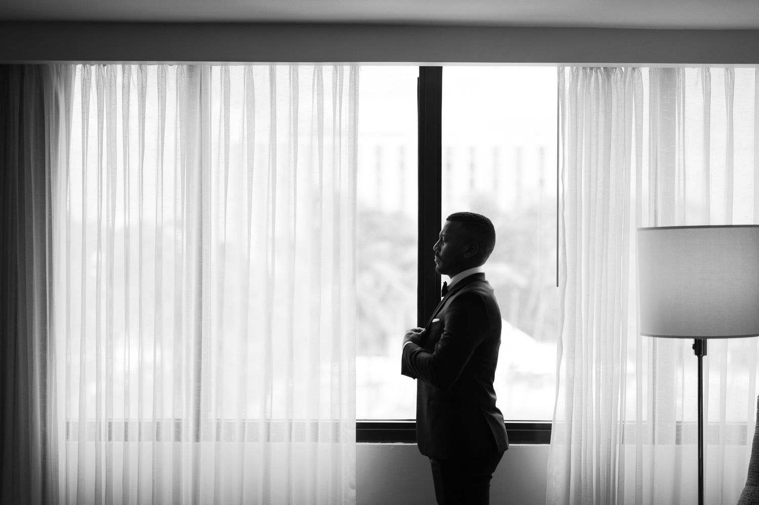 A black and white photo sequence shows a silhouette by a window with vertical blinds, creating a moody atmosphere.