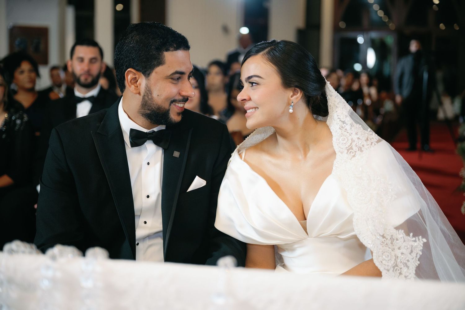 A bride and groom share an intimate moment during their wedding celebration.