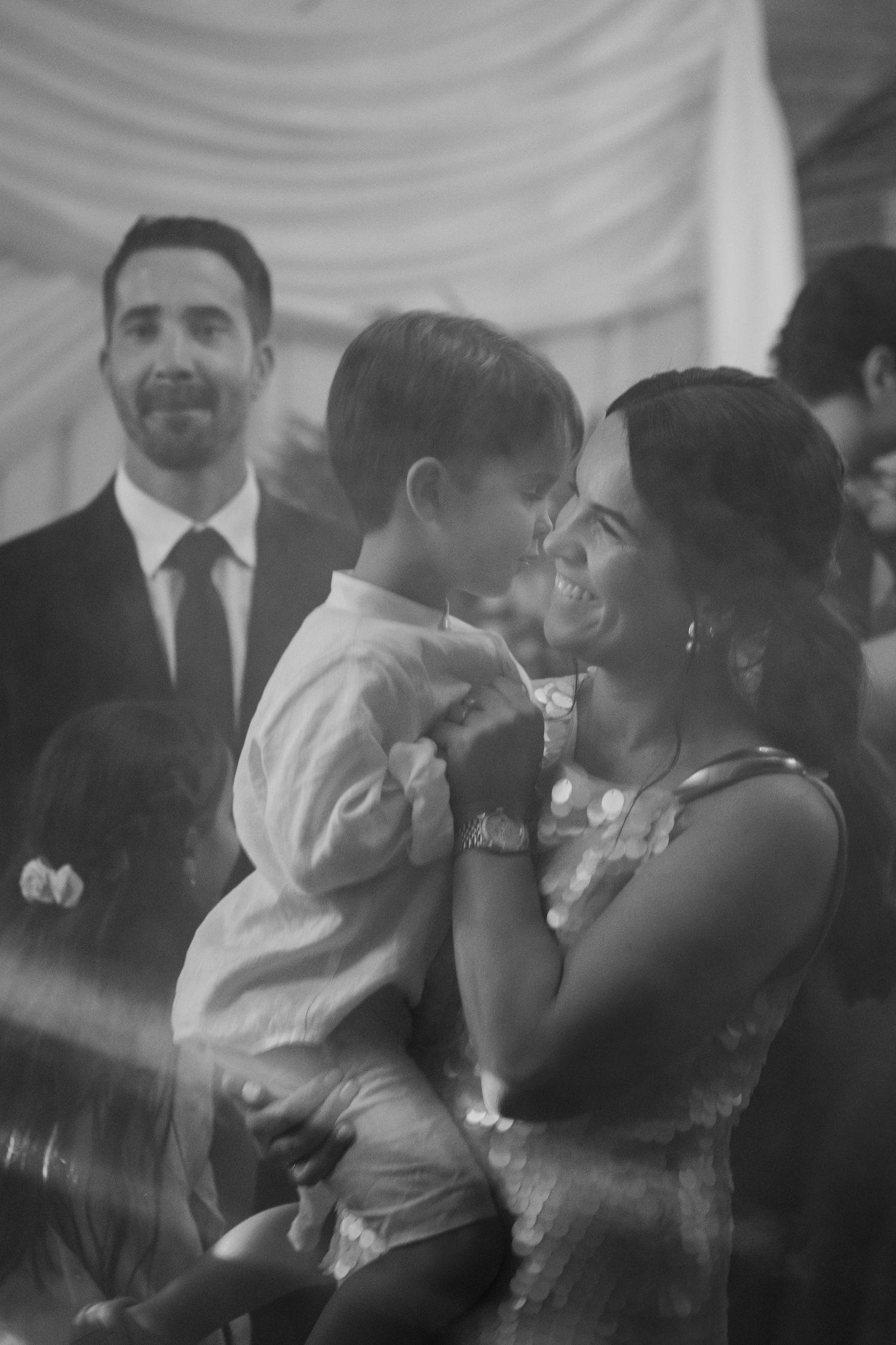 Black and white sequence of a couple sharing their first dance at a wedding reception.