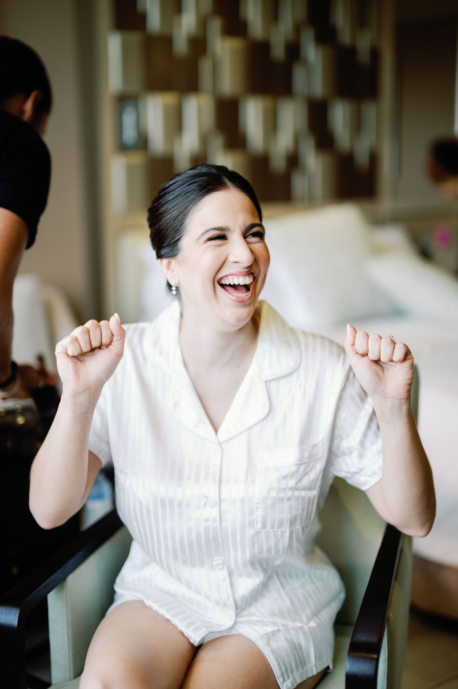 A series of candid shots showing joyful expressions and laughter while wearing a white button-up shirt.