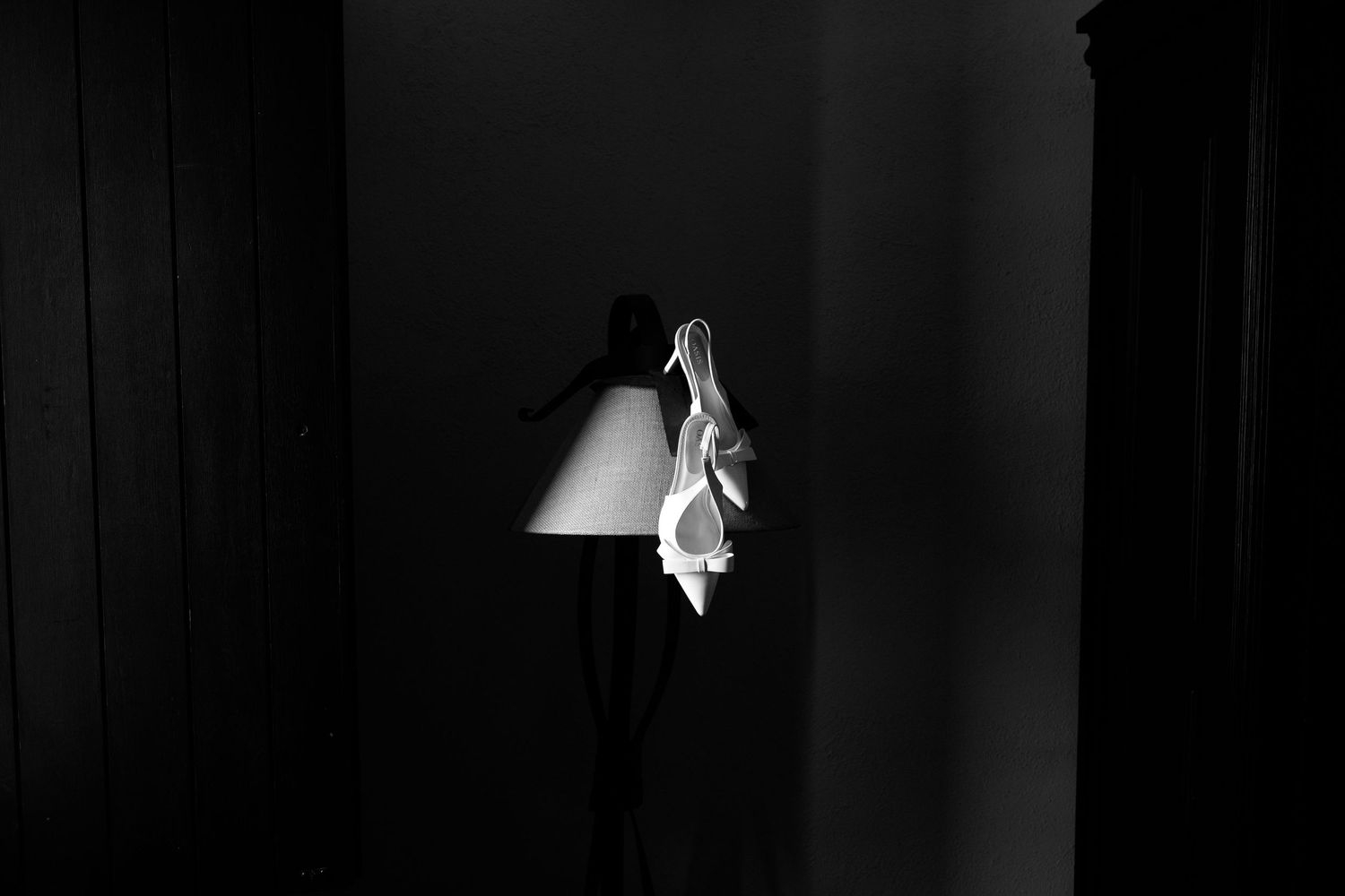 A black and white photo sequence shows someone jumping through a window frame in a dramatic escape.