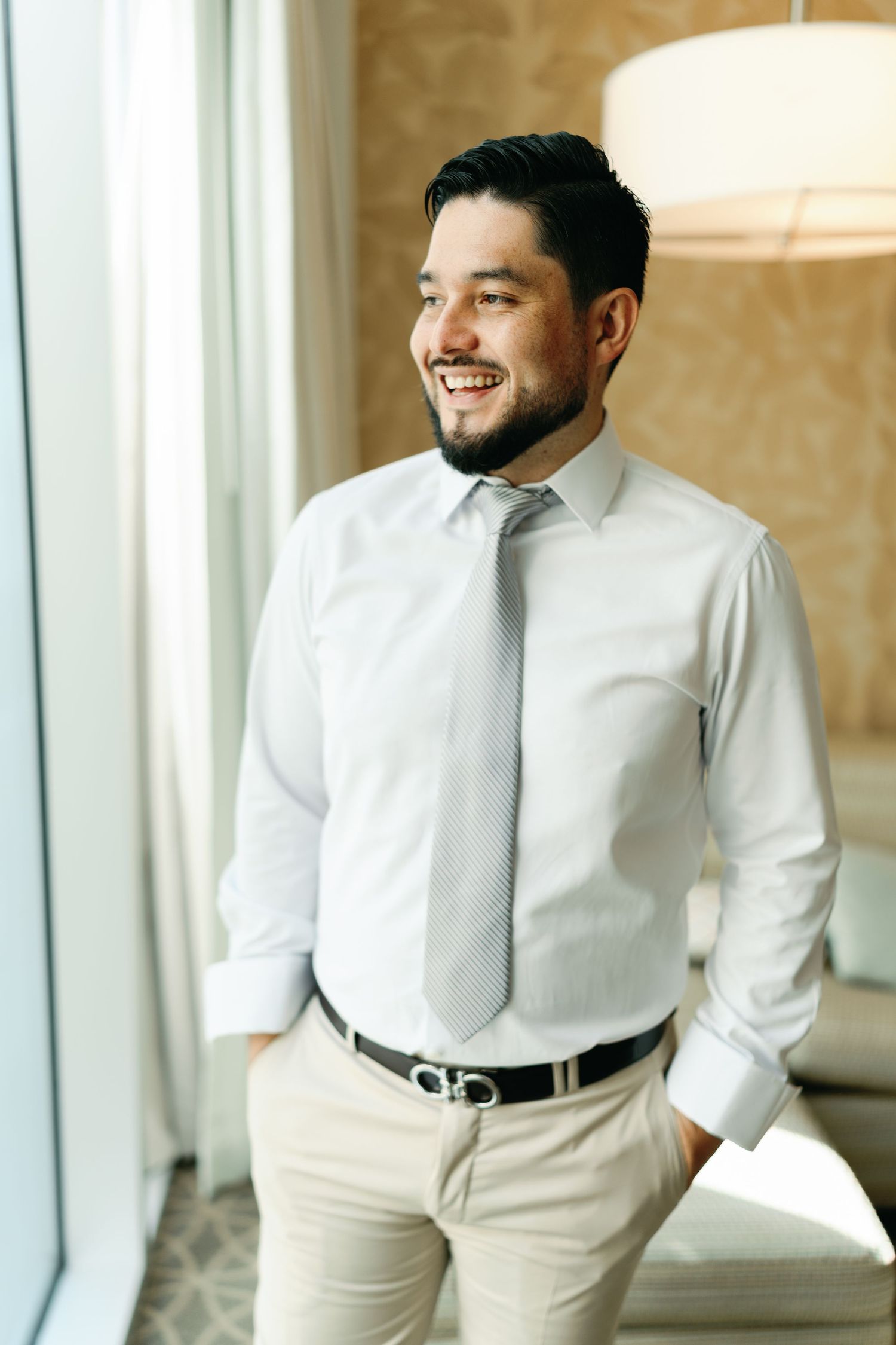 A sequence of photos showing a person in a white dress shirt and khaki pants standing in a bright room.