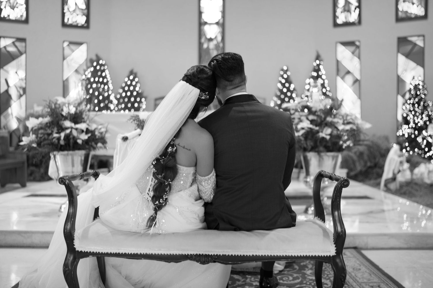 A series of black and white wedding photos showing couples in romantic moments during their celebration.